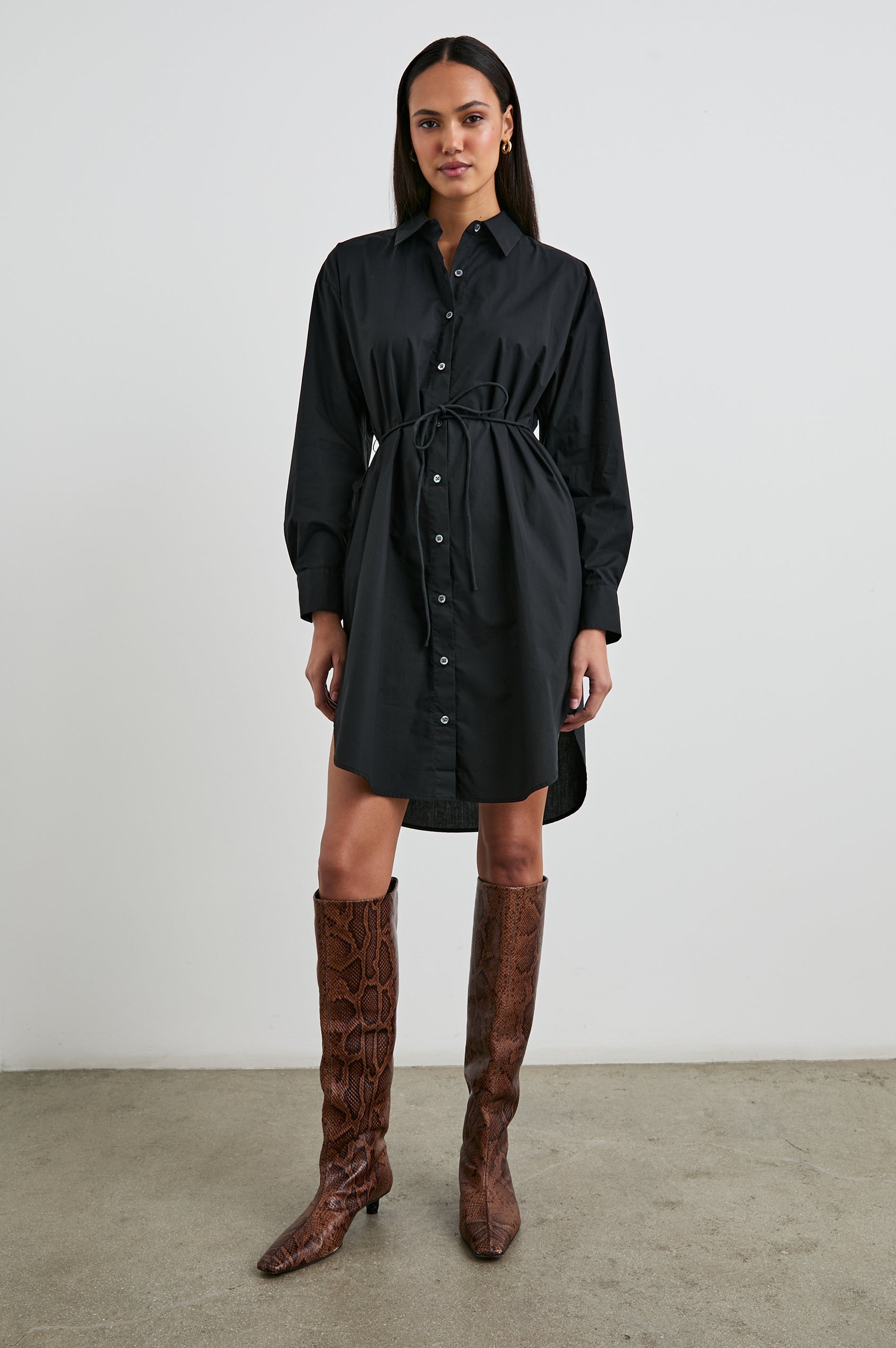 Harmony Long-Sleeve Mini Dress with Buttons Down the Front, Buttoned Cuffs, a Collar, Side Slits and a Tie at the Waist in Black Colorway - Front Full Body View Featured on Model