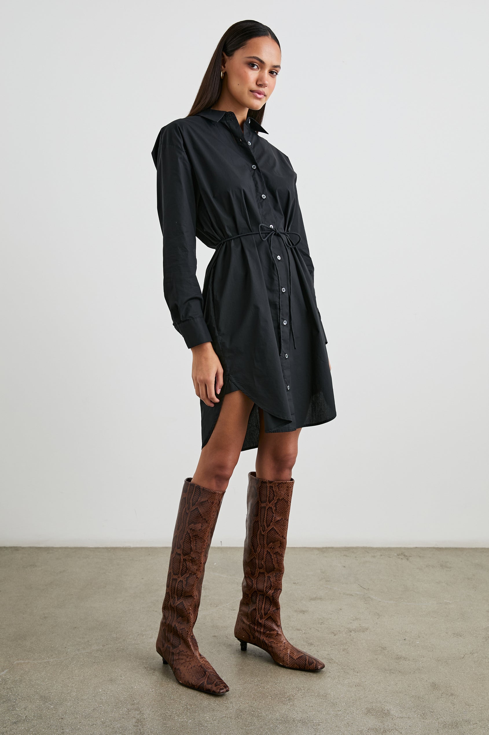 Harmony Long-Sleeve Mini Dress with Buttons Down the Front, Buttoned Cuffs, a Collar, Side Slits and a Tie at the Waist in Black Colorway - Front Full Body View Featured on Model