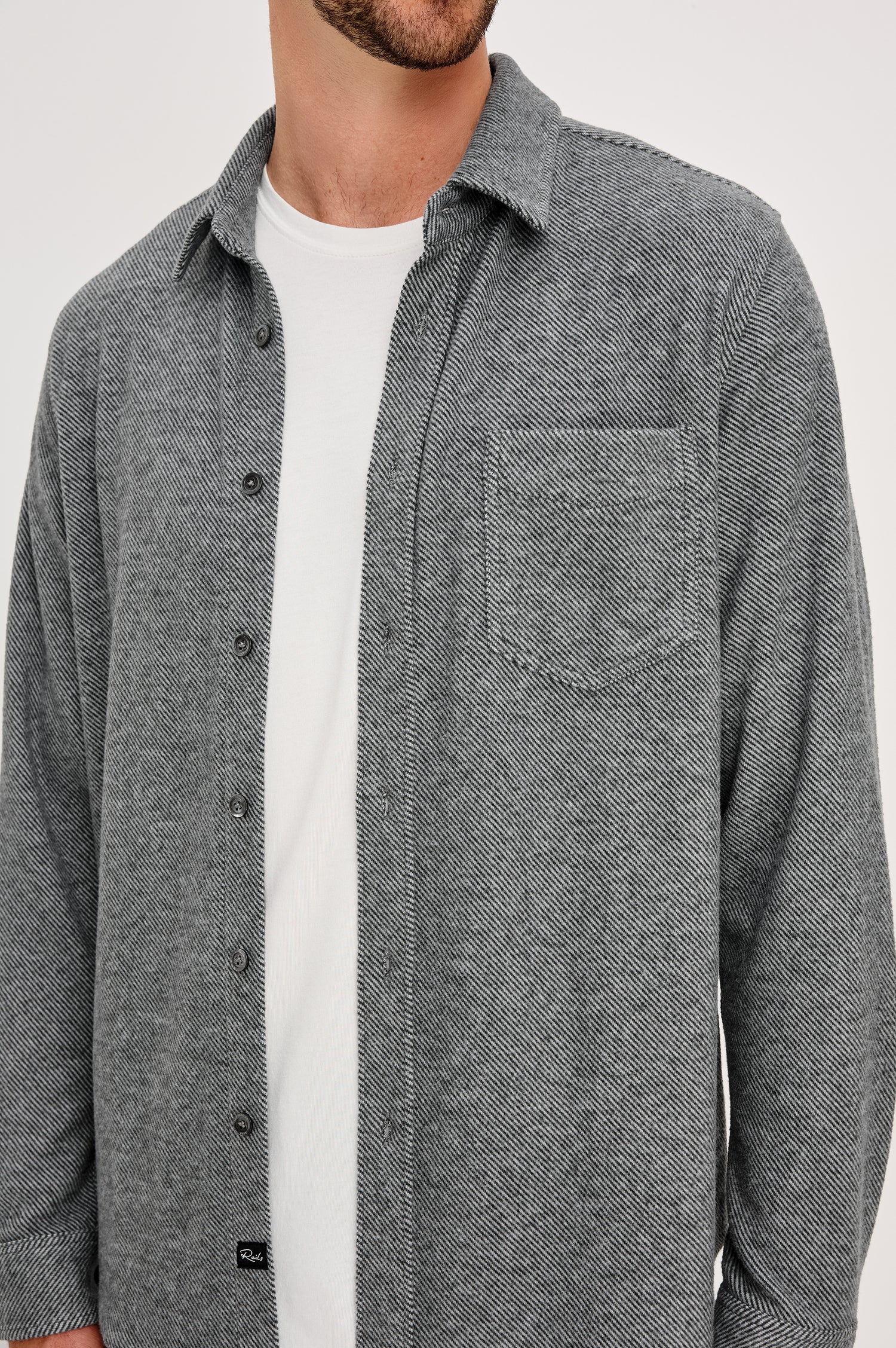 Hawke Long Sleeve Button Front Shirt with a Chest Pocket in Charcoal Twill Colorway. Front Detail View Featured on Model.