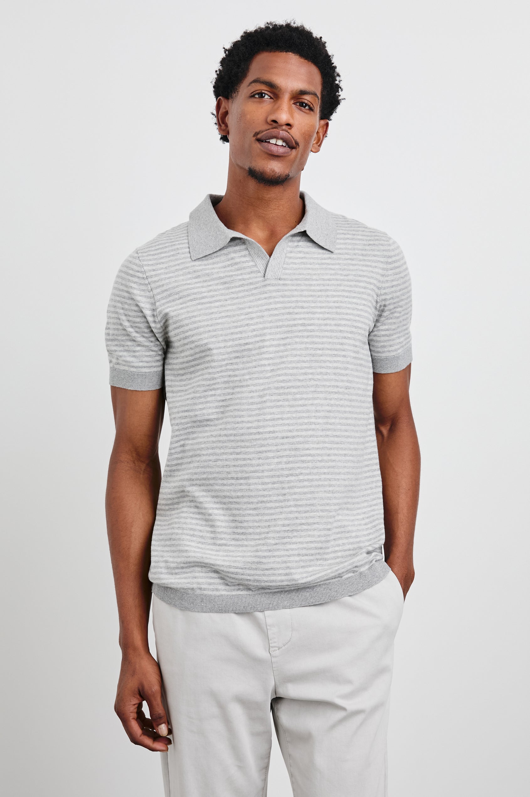 Hayden Short-Sleeve Polo Shirt with a Buttonless Placket in Heather Grey Stripe Colorway, horizontal stripes with vertical stripes on placket and trim - Front View Featured on Model