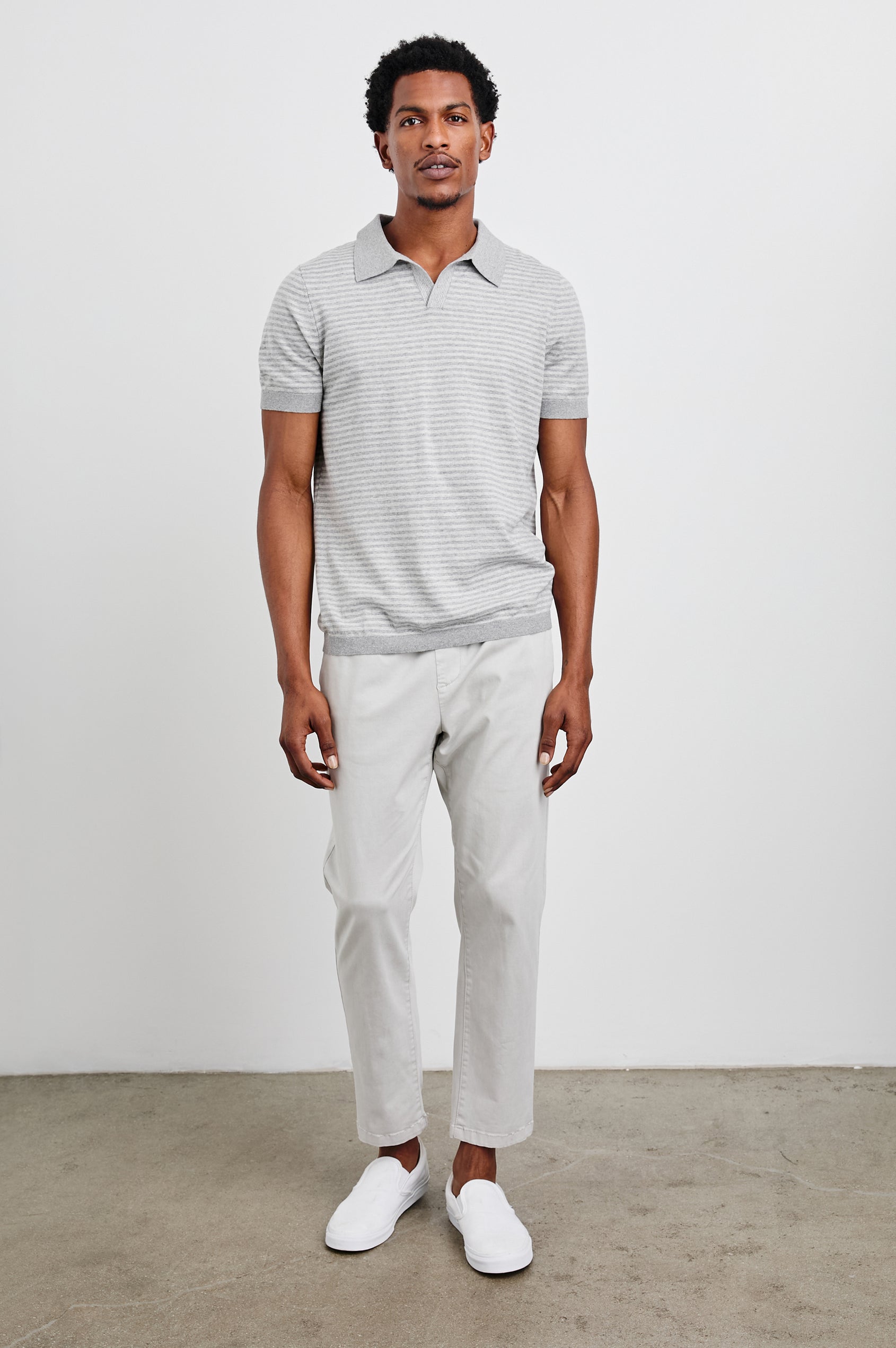 Hayden Short-Sleeve Polo Shirt with a Buttonless Placket in Heather Grey Stripe Colorway, horizontal stripes with vertical stripes on placket and trim - Front Full Body View Featured on Model
