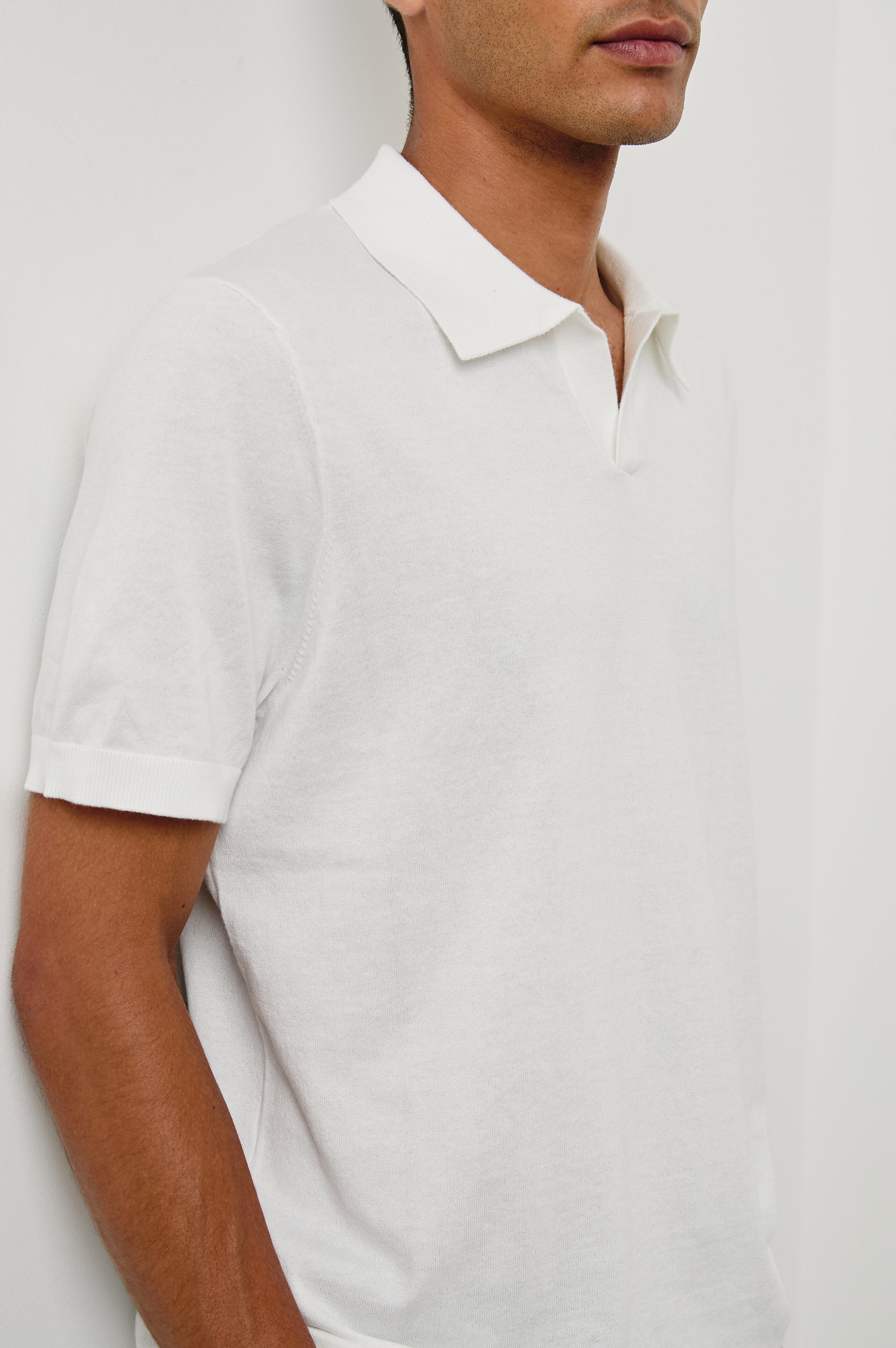 Hayden cotton short sleeve polo with collar and short placket in White - close up of details on model