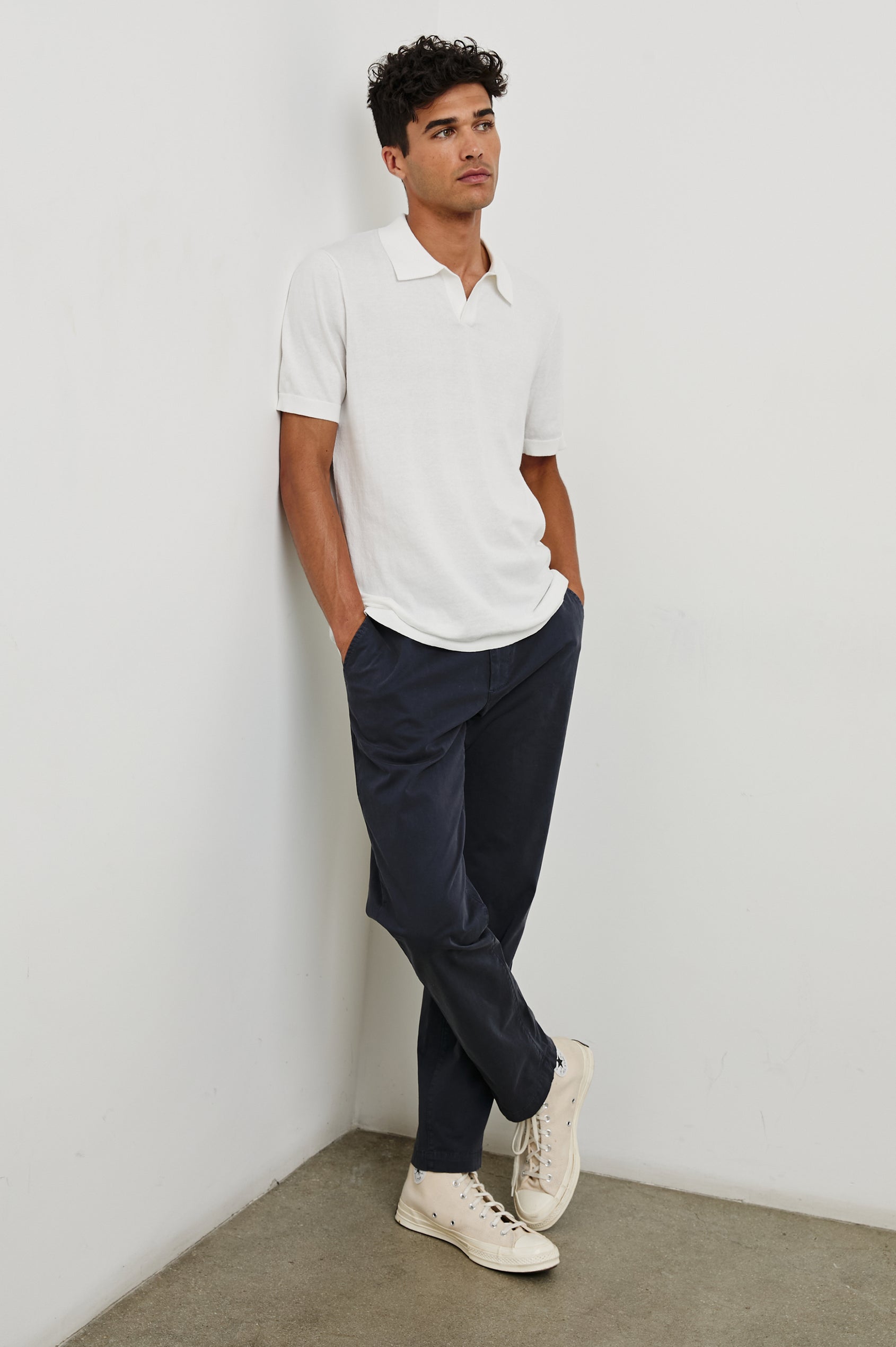 Hayden cotton short sleeve polo with collar and short placket in White - full body front view on model