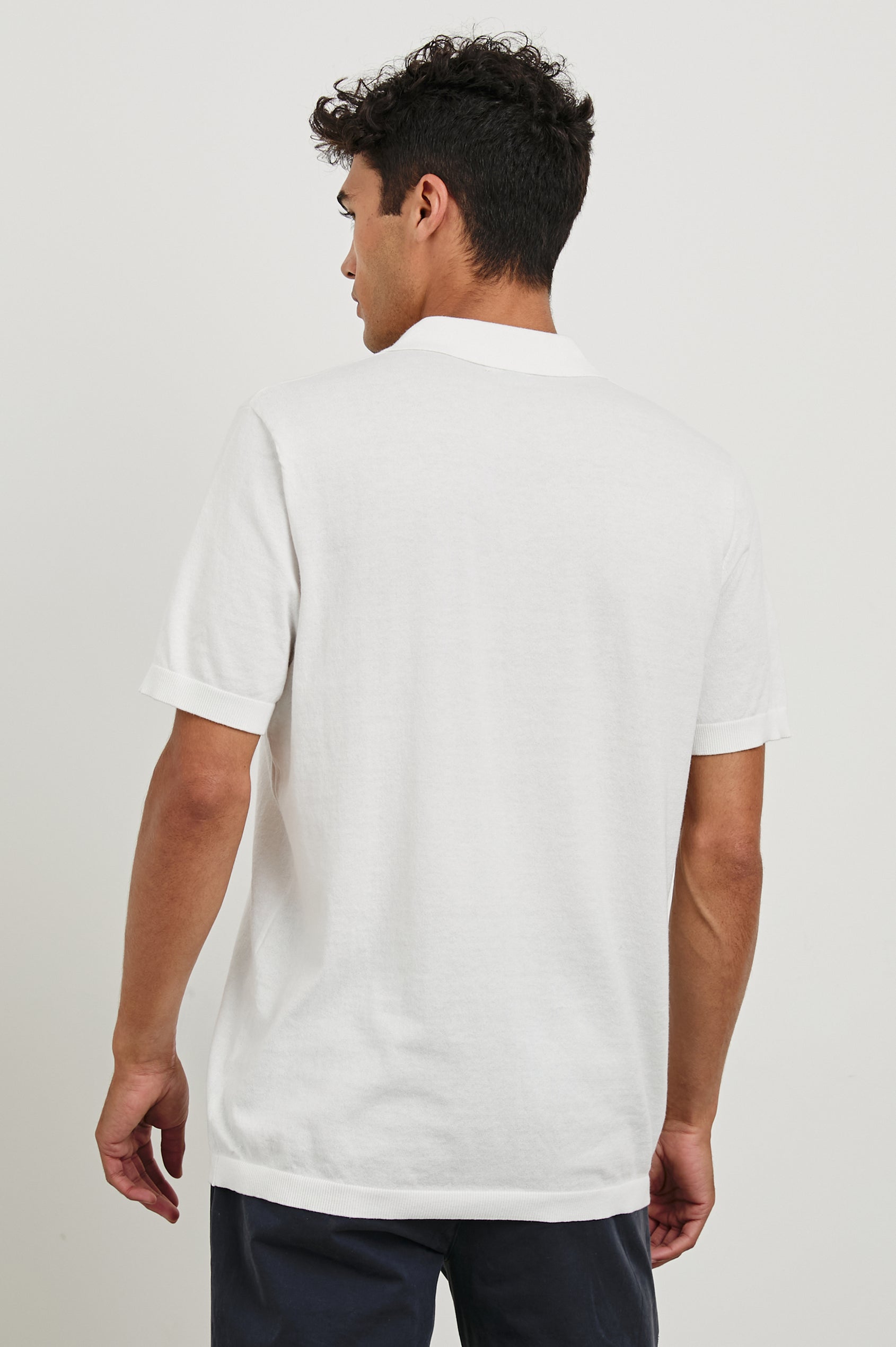 Hayden cotton short sleeve polo with collar and short placket in White - back view on model