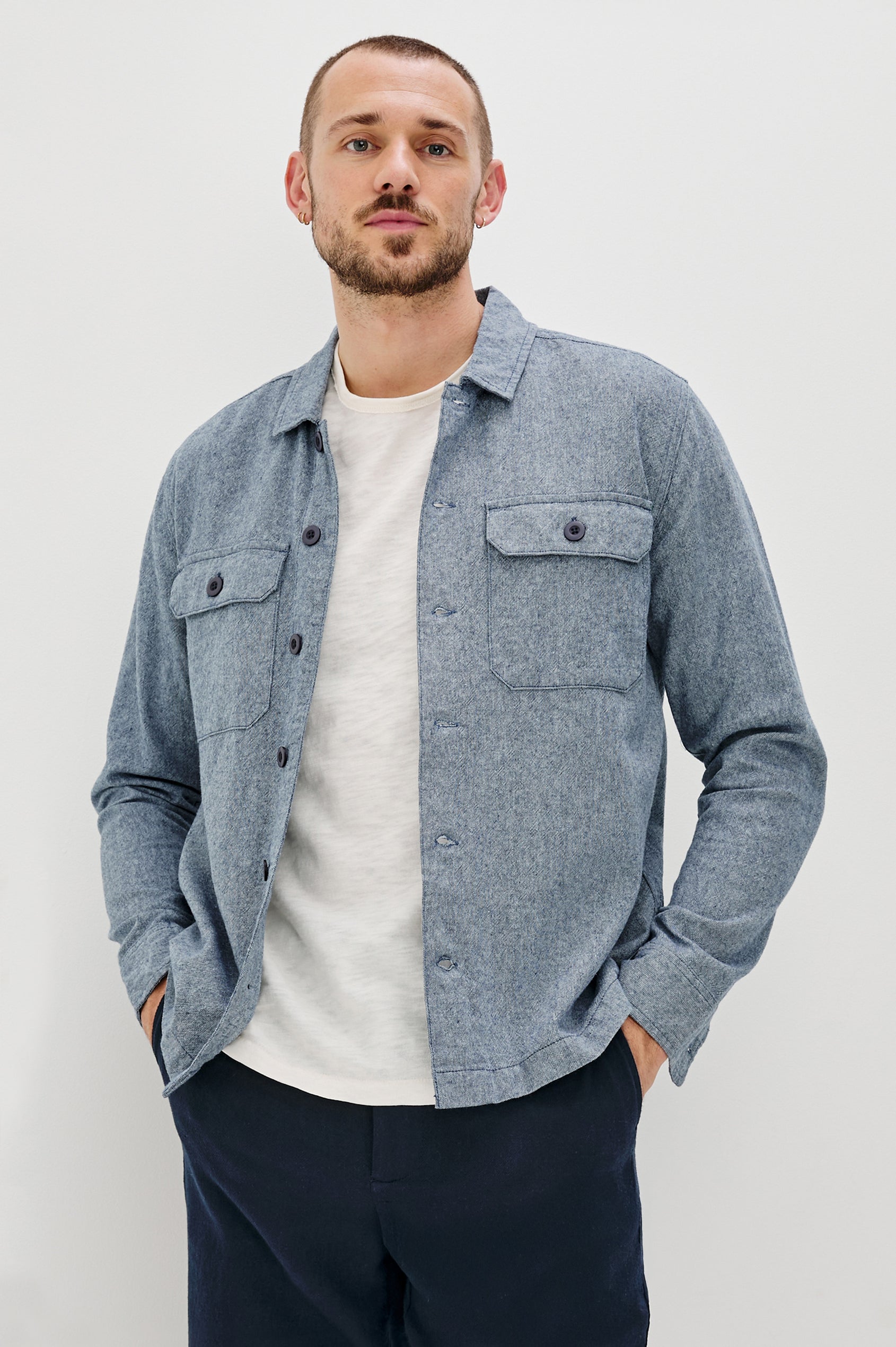 Hayes Shirt Jacket with Long Sleeves and Chest Flap Pockets with Button Closure, Exposed Button Front in Blue Mirage. Front View Shown on Model.