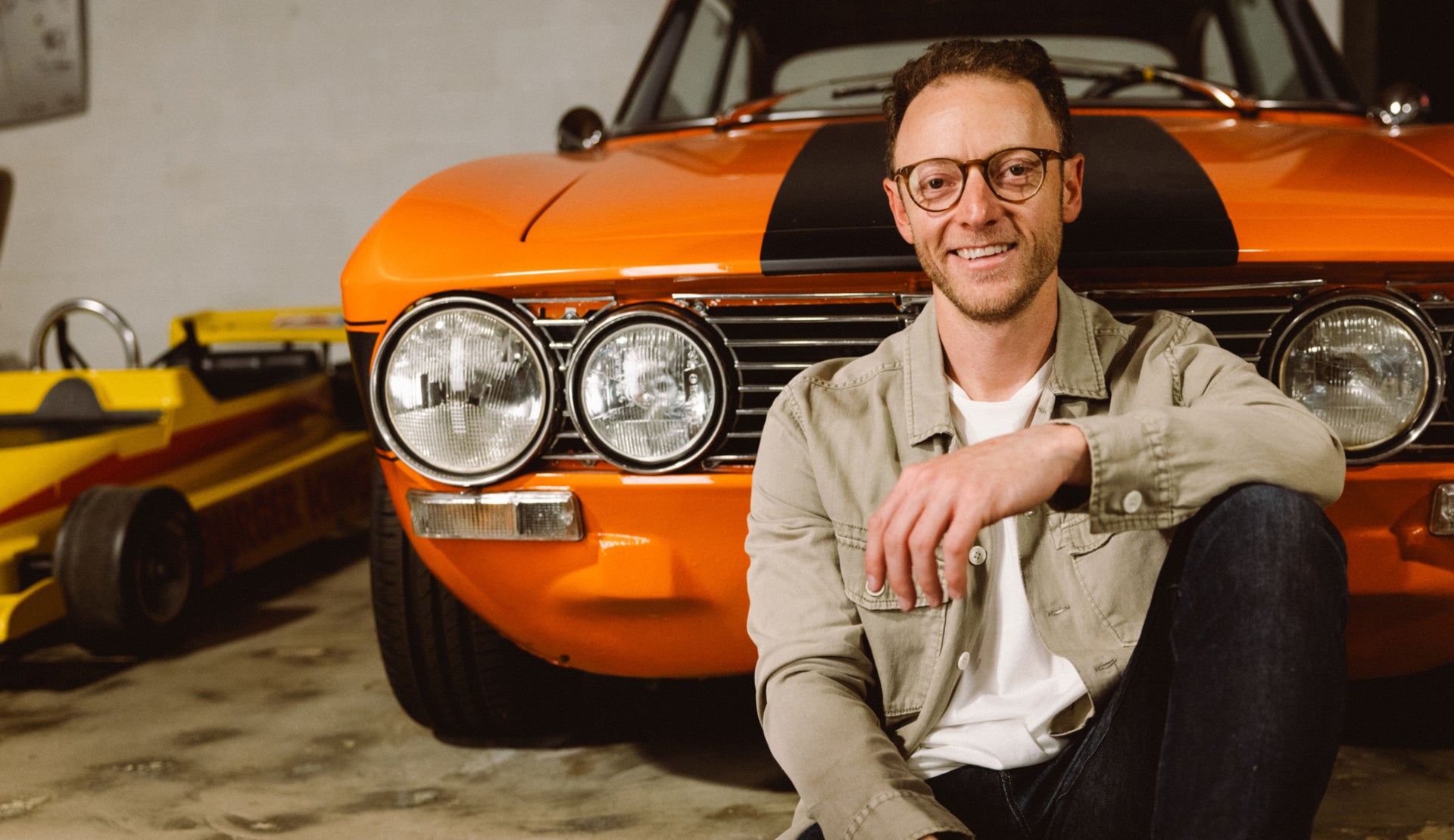 MALE WEARING KEROUAC SHIRT JACKET (LIGHT WEIGHT JACKET WITH WHITE BUTTON CLOSURE) IN COLOR NATURAL (TAN)