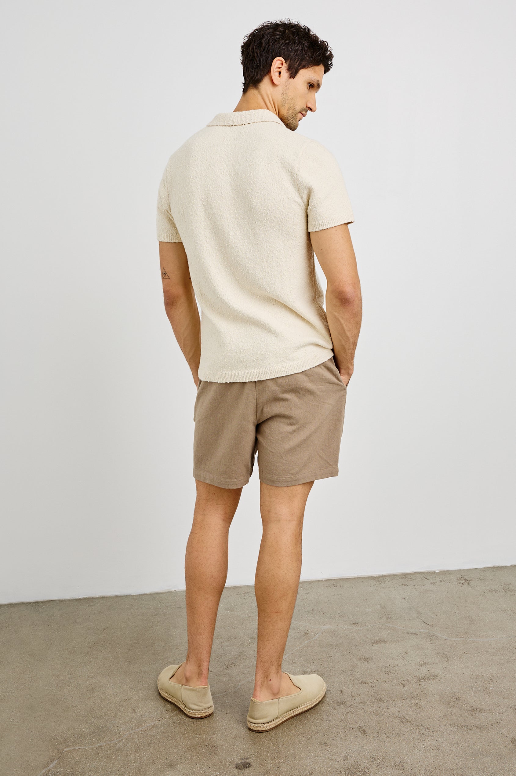 Heath Polo Shirt with Short Sleeves in Cream Colorway. Back View Shown on Model.