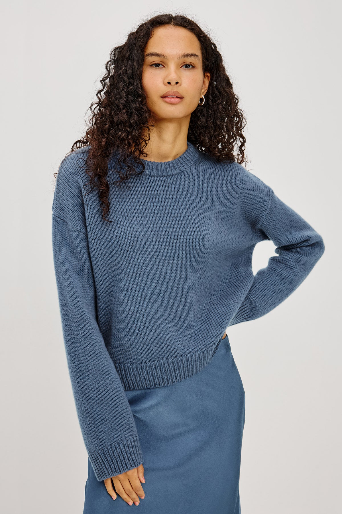 Helly Sweater in Wool-Cashmere Blend With Crew Neckline, Relaxed Boxy Slightly Cropped Fit, Long Sleeves, and Ribbed Trim in Atlantic Colorway - Upper Body Front View Featured on Model