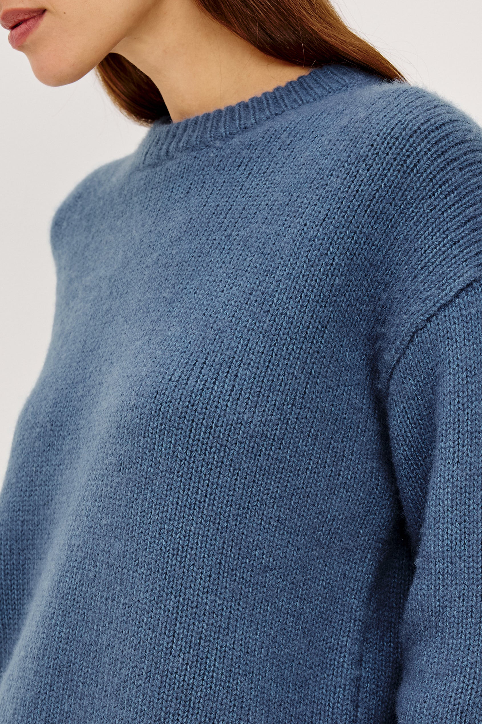 Helly Sweater in Wool-Cashmere Blend With Crew Neckline, Relaxed Boxy Slightly Cropped Fit, Long Sleeves, and Ribbed Trim in Atlantic Colorway - Upper Body Front View Featured on Model