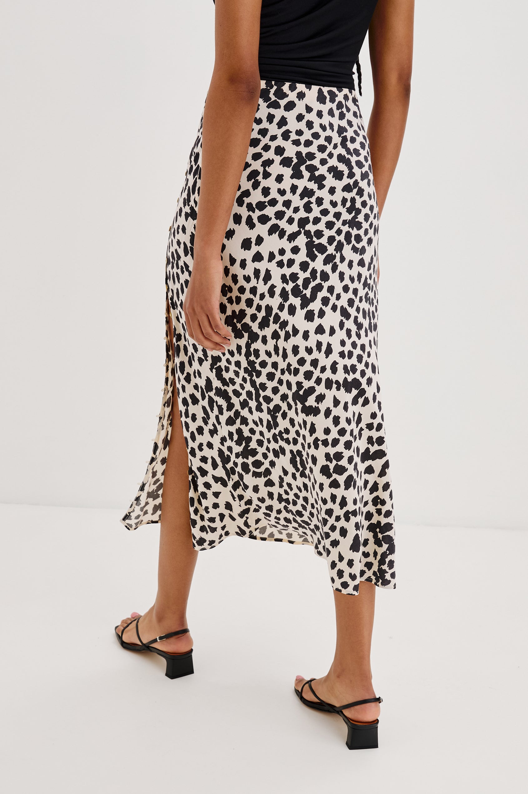 Hepburn Midi Skirt with Forward Facing Adjustable Button Front Side Seam in Taupe Spotted Colorway. Back View Shown on Model.