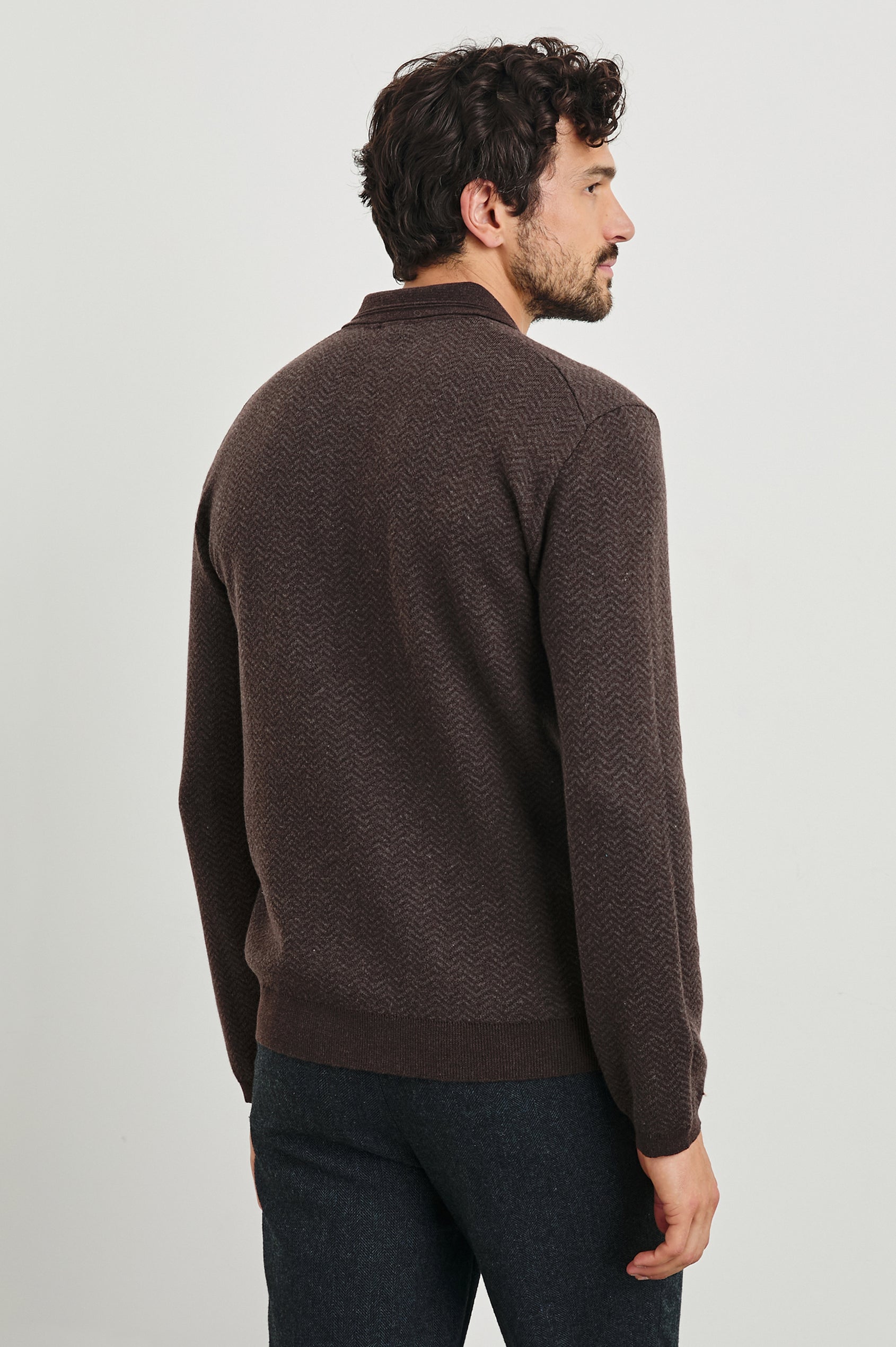 Herrington Long-Sleeve Collared Sweater with a Two Button Placket and a Herringbone Jacquard in Brown Herringbone Melange Colorway - Back View Featured on Model