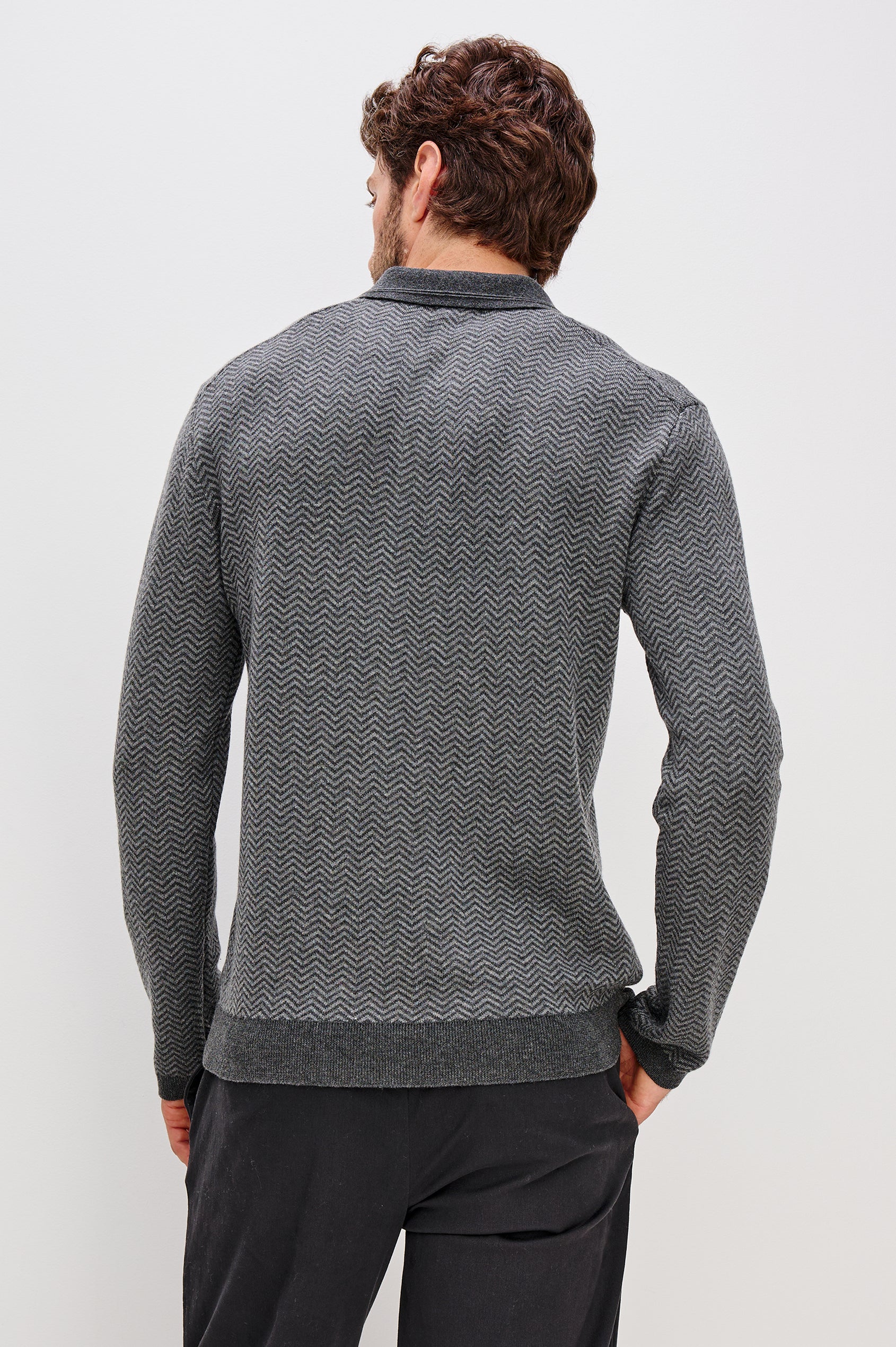 Herrington Long-Sleeve Collared Sweater with a Two Button Placket and a Herringbone Jacquard in Charcoal Herringbone Melange Colorway. Back View Featured on Model.