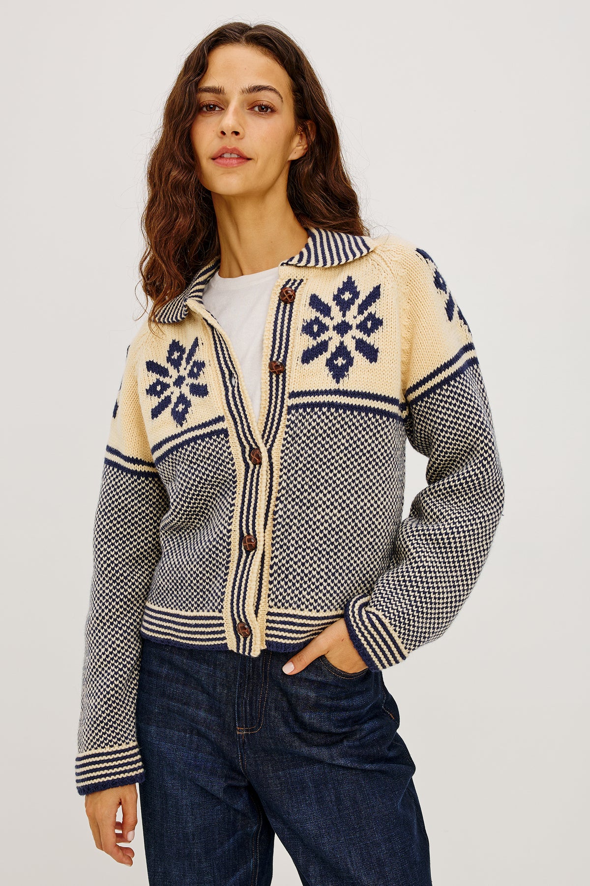 Hilde Cardigan in Fair Isle Jacquard Knit With Relaxed Fit, Wide Collar, Front Buttons, and Long Sleeves in Snowflake Colorway - Upper Body Front View Featured on Model.