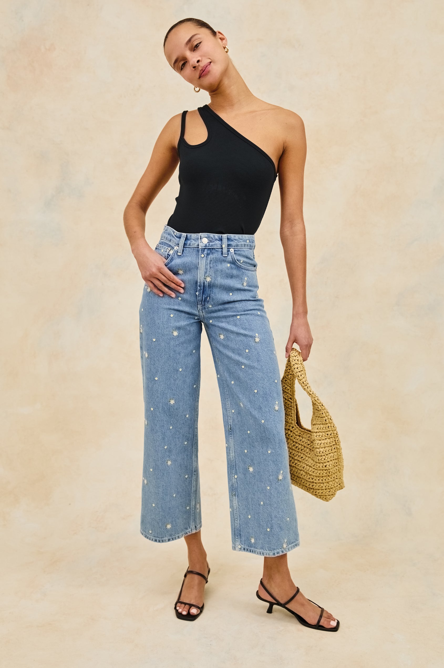 Hira asymmetrical tank top with keyhole sleeve feature in Black -  stylized full body front view on model