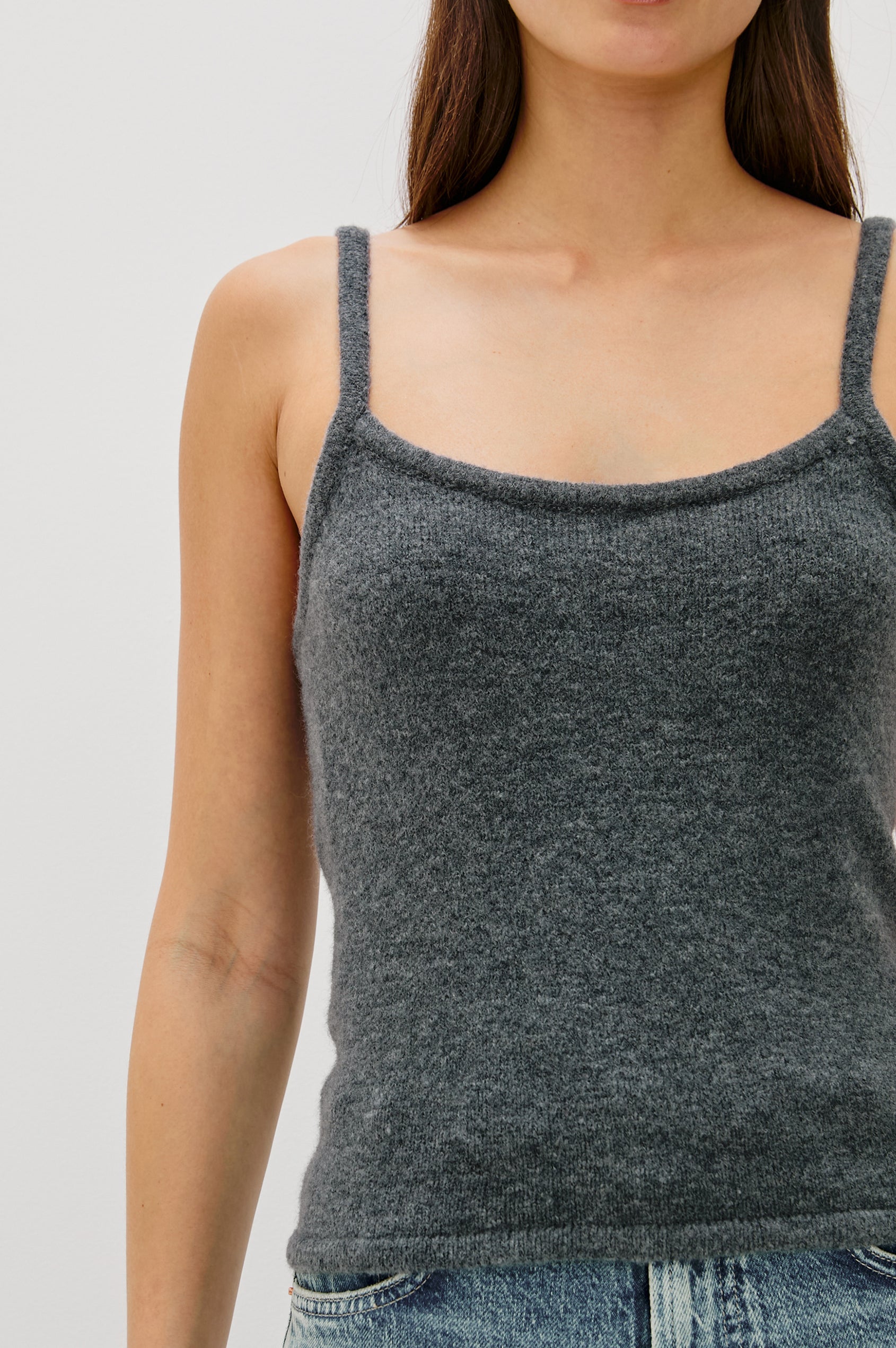 A knitted wool-blend tank top with a simple, classic fit in Charcoal Colorway. Close Up View featured on Model.