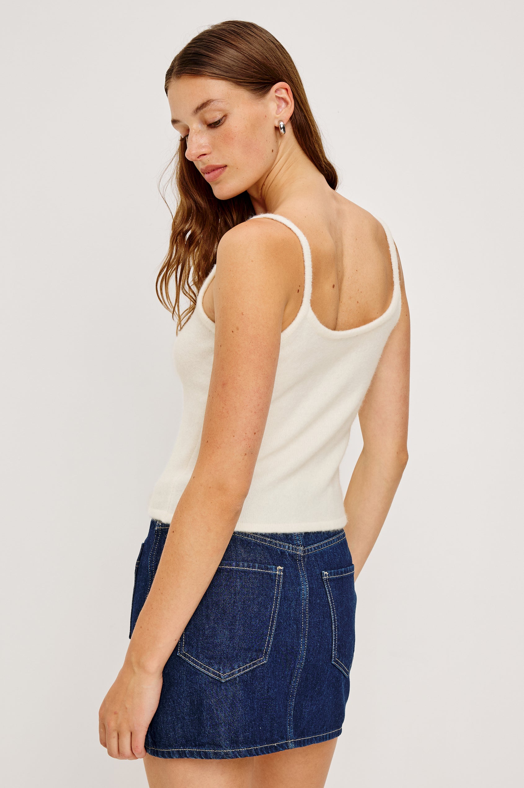 A knitted wool-blend tank top with a simple, classic fit in Ivory Colorway. Back View featured on Model.
