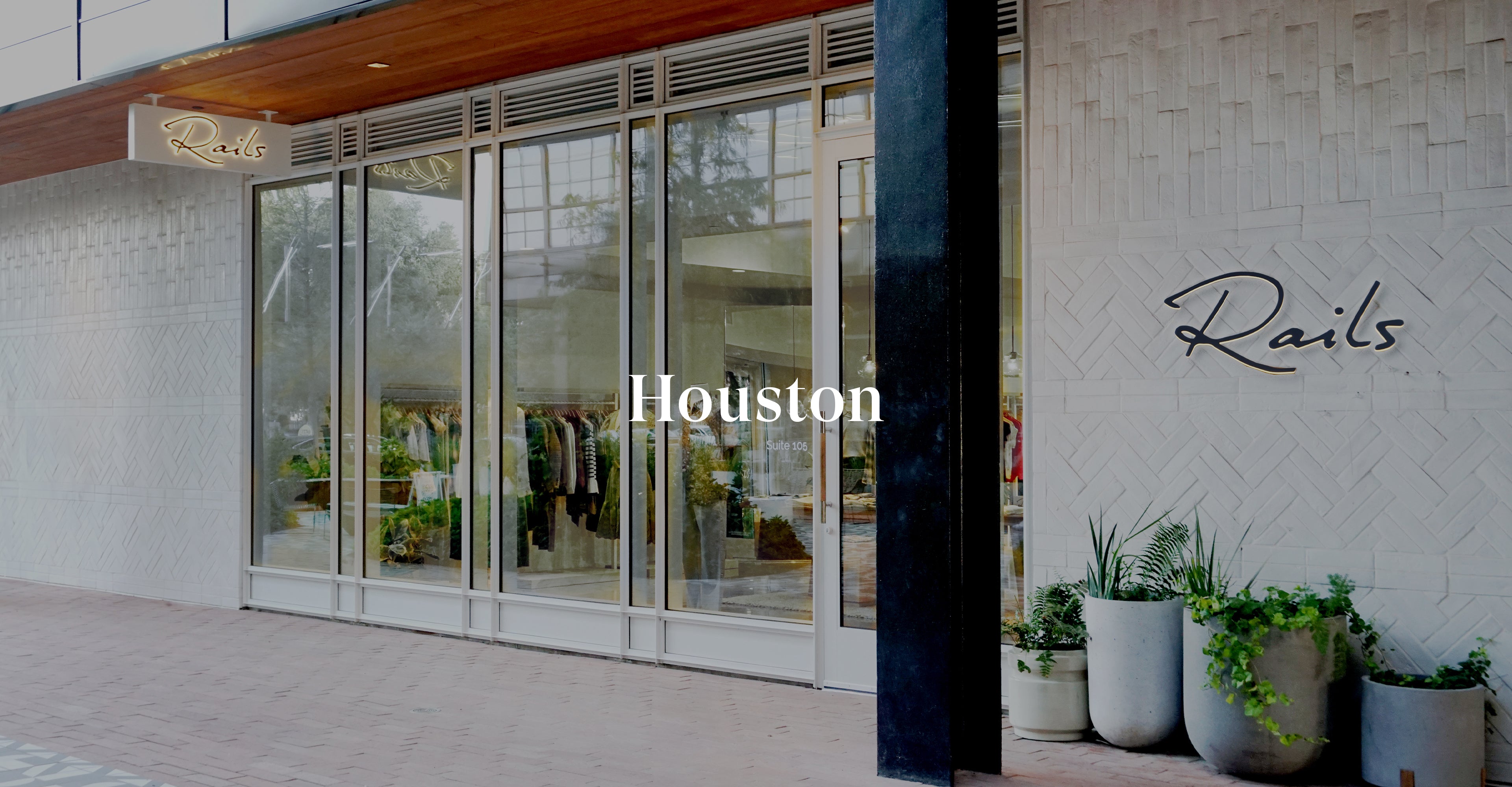 OUTSIDE OF THE HOUSTON STORE SHOWING THE FRONT ENTRANCE AND FRONT WINDOWS (LARGE GLASS DOOR WITH LARGE FLOOR TO CIELING WINDOWS) 