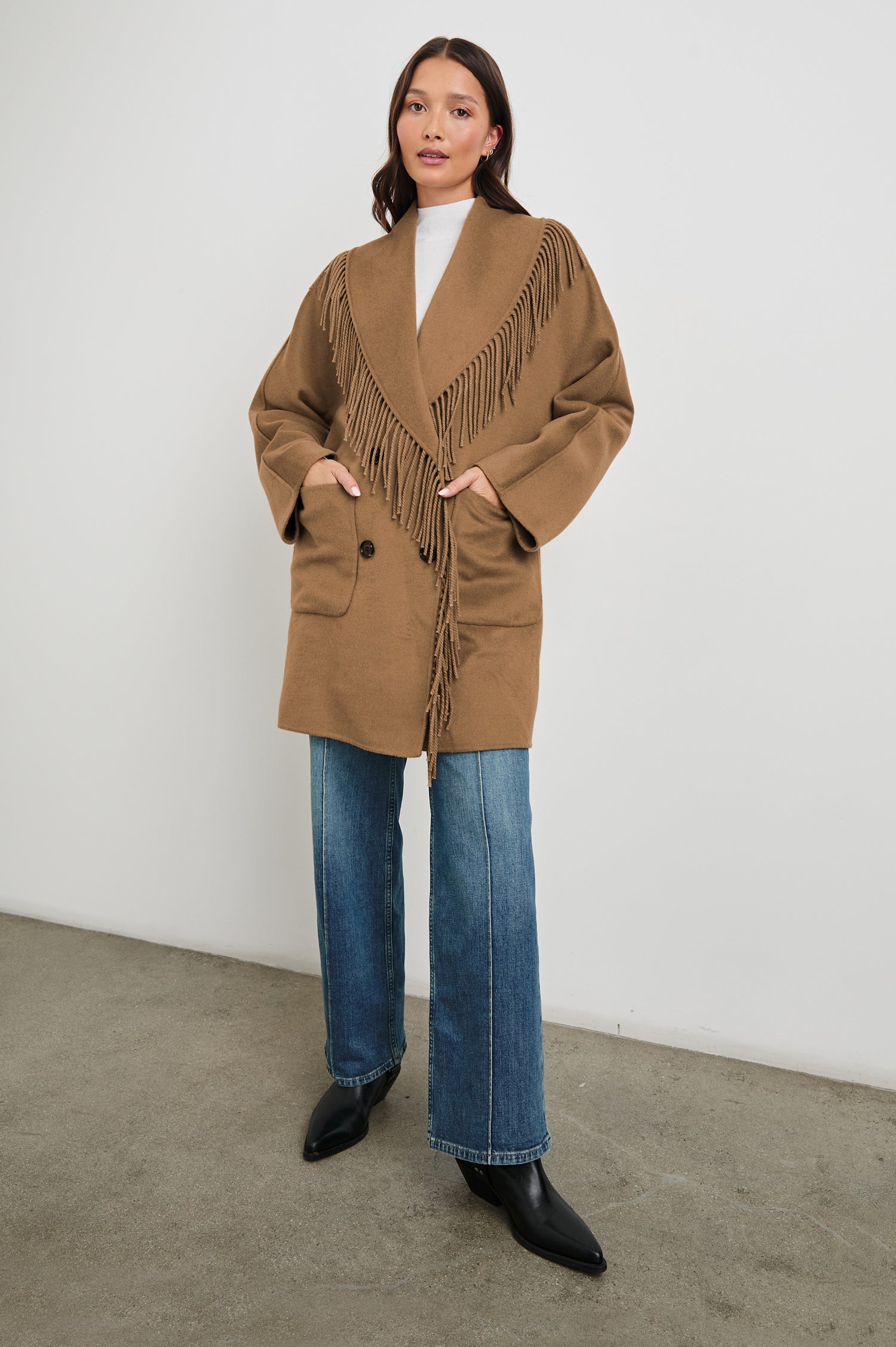 Hugo Double-Breasted, Mid-Thigh Length Coat with Button Closure, Wide Lapels, Two Front Patch Pockets and Fringe along the Lapels and Closure in Camel Colorway - Front Full Body View Featured on Model 