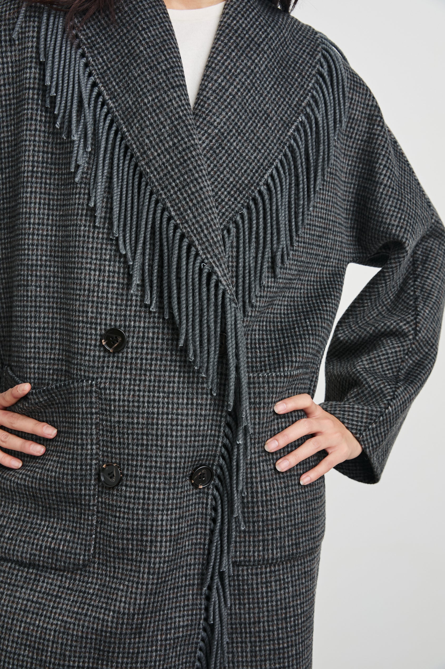 Hugo Double-Breasted, Mid-Thigh Length Coat with Button Closure, Wide Lapels, Two Front Patch Pockets and Fringe along the Lapels and Closure in Charcoal Check Colorway, a plaid - Front View Featured on Model 