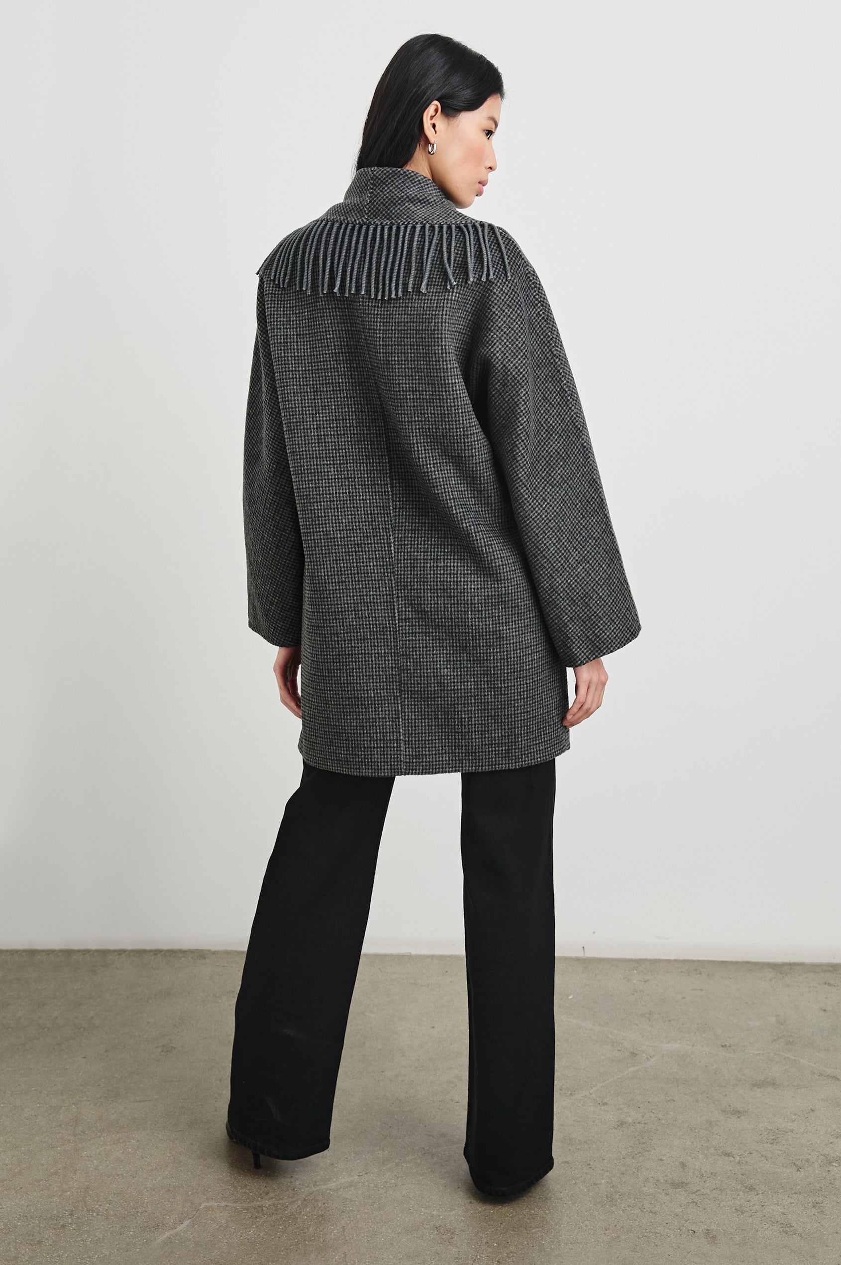 Hugo Double-Breasted, Mid-Thigh Length Coat with Button Closure, Wide Lapels, Two Front Patch Pockets and Fringe along the Lapels and Closure in Charcoal Check Colorway, a plaid - Back Full Body View Featured on Model 