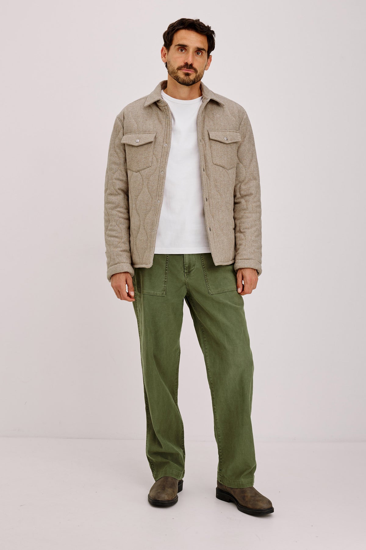 Humboldt Jacket in Wool Blend With Herringbone Texture, Channel Quilting, Filling, Snap Front, Collar, and Chest Flap Pockets in Stonefield Herringbone Colorway - Full Body Front View Featured on Model.