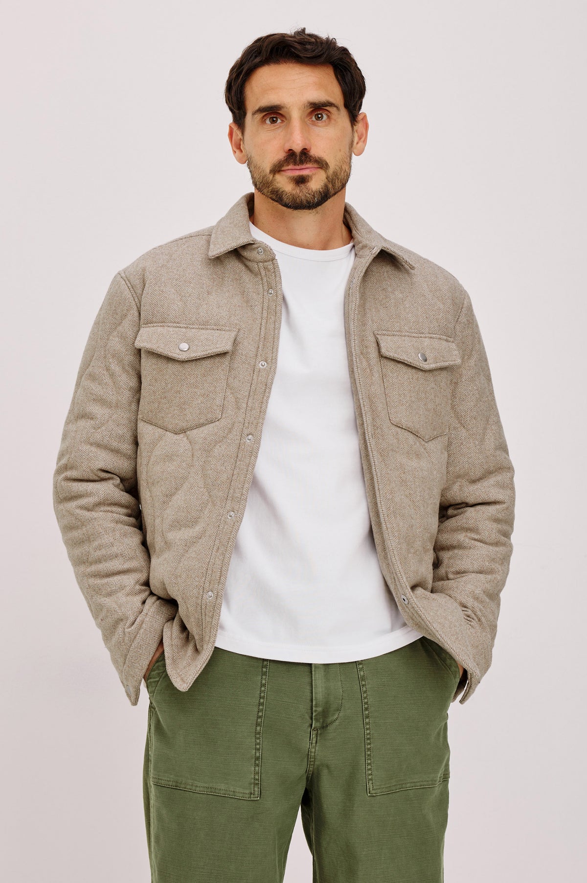 Humboldt Jacket in Wool Blend With Herringbone Texture, Channel Quilting, Filling, Snap Front, Collar, and Chest Flap Pockets in Stonefield Herringbone Colorway - Front View Featured on Model.