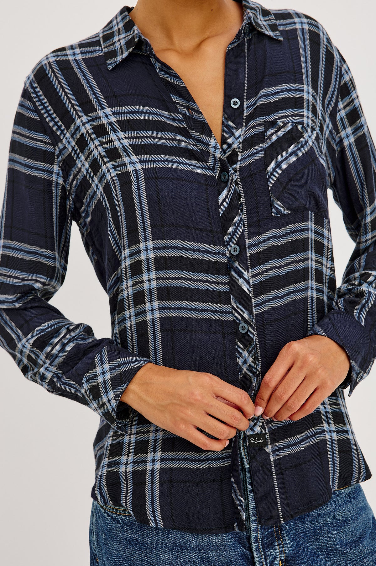 Hunter Shirt Plaid Button-Up With Relaxed Fit, Spread Collar, Chest Pocket, Long Sleeves, and Curved Hem in Indigo Sky Colorway - Front Crop Detail View Featured on Model.