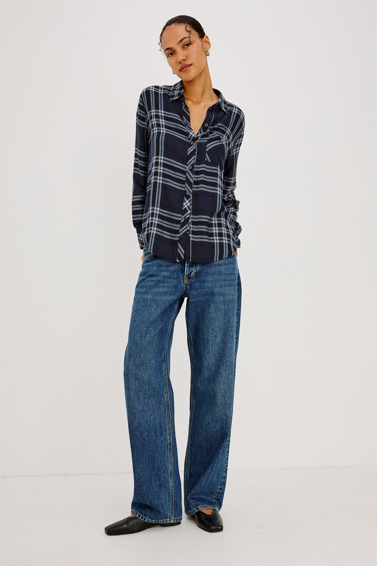 Hunter Shirt Plaid Button-Up With Relaxed Fit, Spread Collar, Chest Pocket, Long Sleeves, and Curved Hem in Indigo Sky Colorway - Front Full Body View Featured on Model.