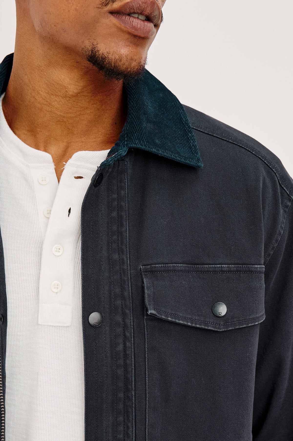 Huntly Jacket in Twill With Plaid Lining, Corduroy Collar, Storm Flap Snap-and-Zip, Four Front Snap Flap Pockets, and Long Sleeves in Creosote Colorway - Upper Body Front View Featured on Model