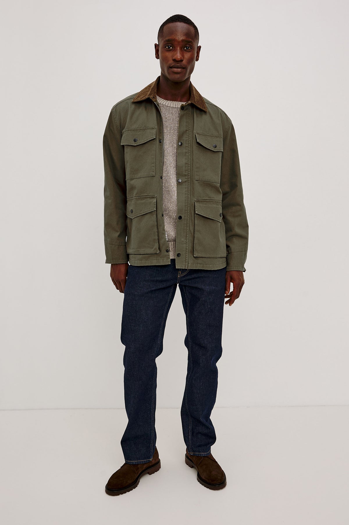 Huntly Jacket in Twill With Plaid Lining, Corduroy Collar, Storm Flap Snap-and-Zip, Four Front Snap Flap Pockets, and Long Sleeves in Highland Colorway - Full Body Front View Featured on Model