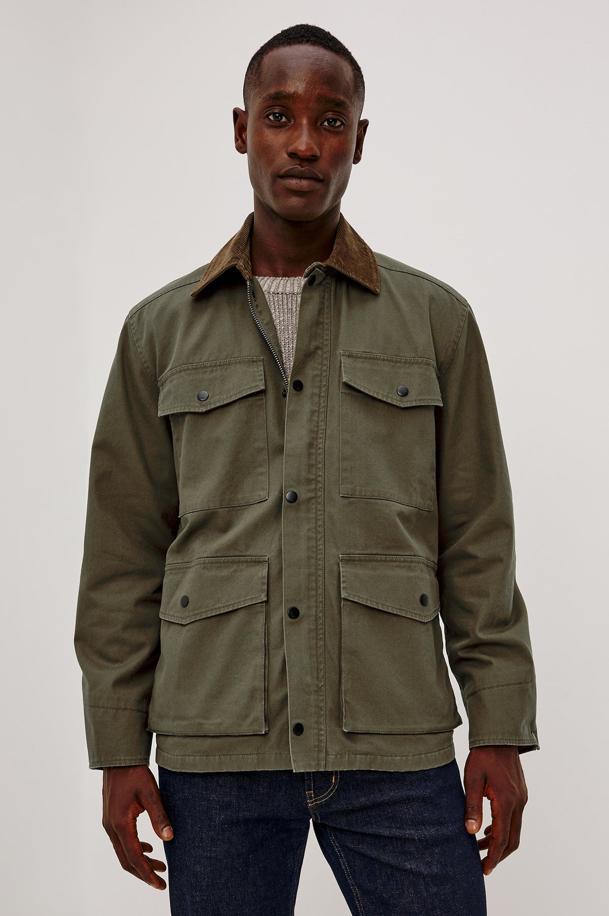 Huntly Jacket in Twill With Plaid Lining, Corduroy Collar, Storm Flap Snap-and-Zip, Four Front Snap Flap Pockets, and Long Sleeves in Highland Colorway - Upper Body Front View Featured on Model