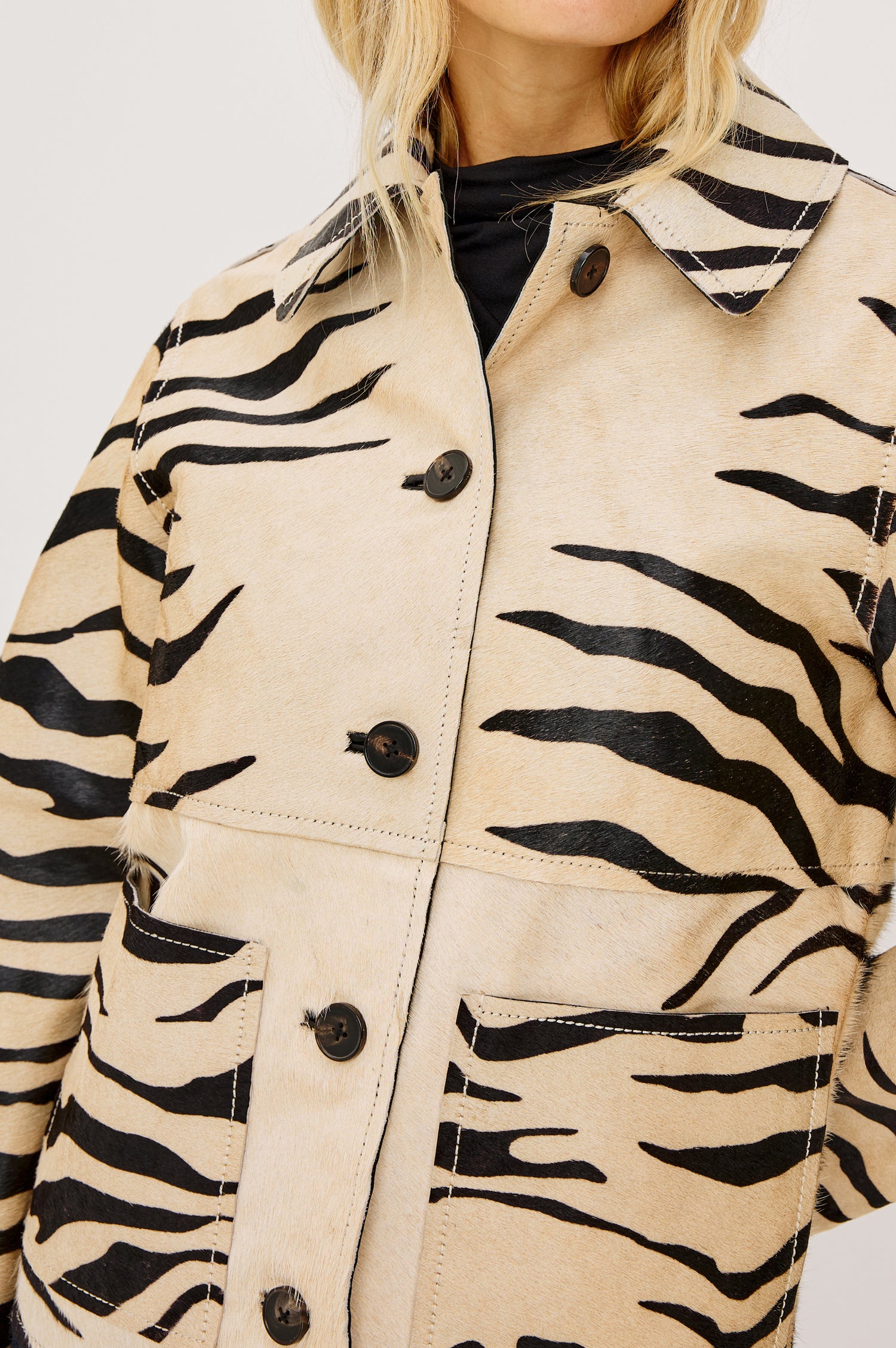 Haisley Leather Zebra Haircalf Jacket with Two Front Patch Pockets in a tan and black colorway - Front Detail View Featured on Model 