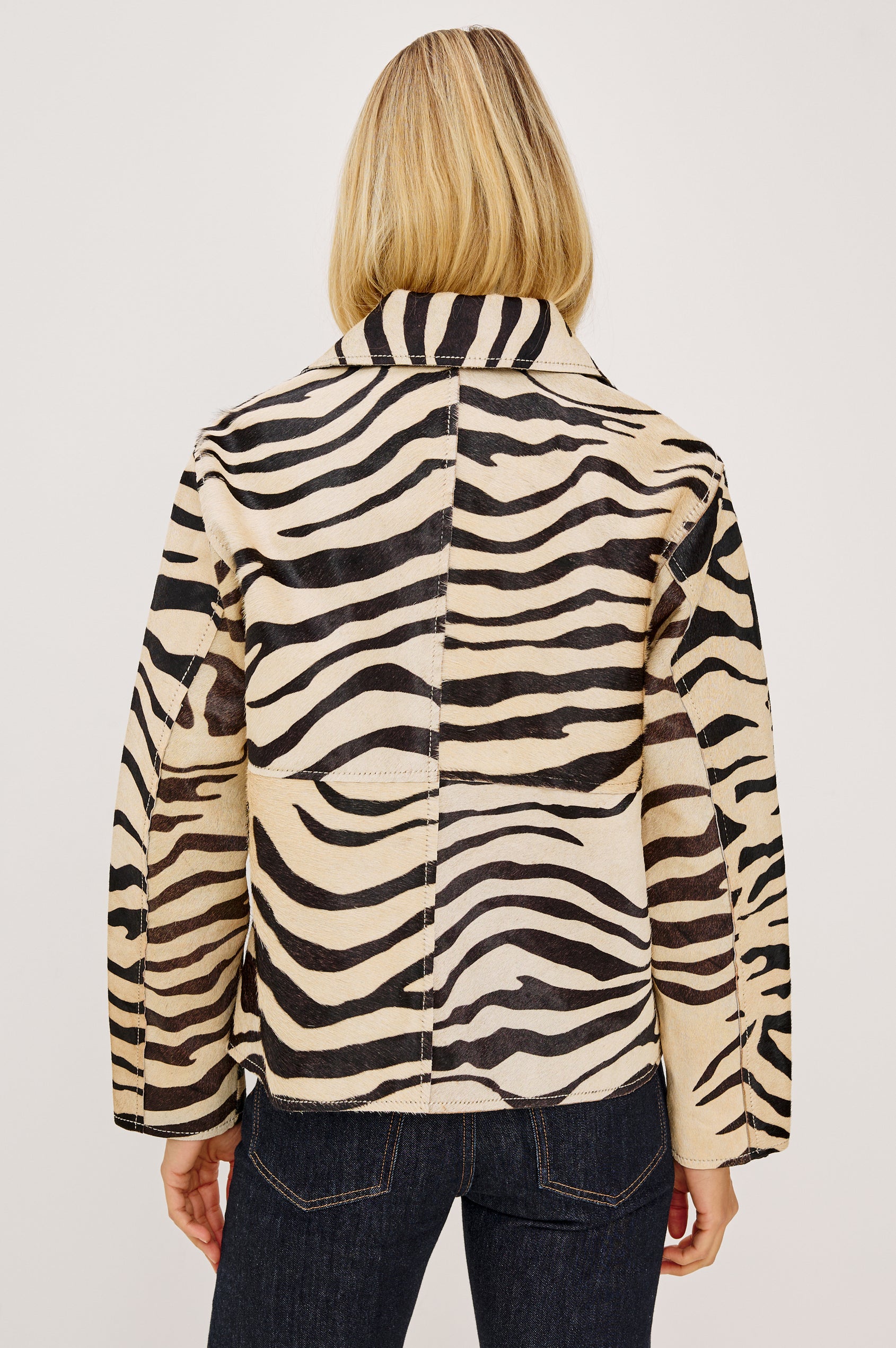 Haisley Leather Zebra Haircalf Jacket with Two Front Patch Pockets in a tan and black colorway - Back View Featured on Model 