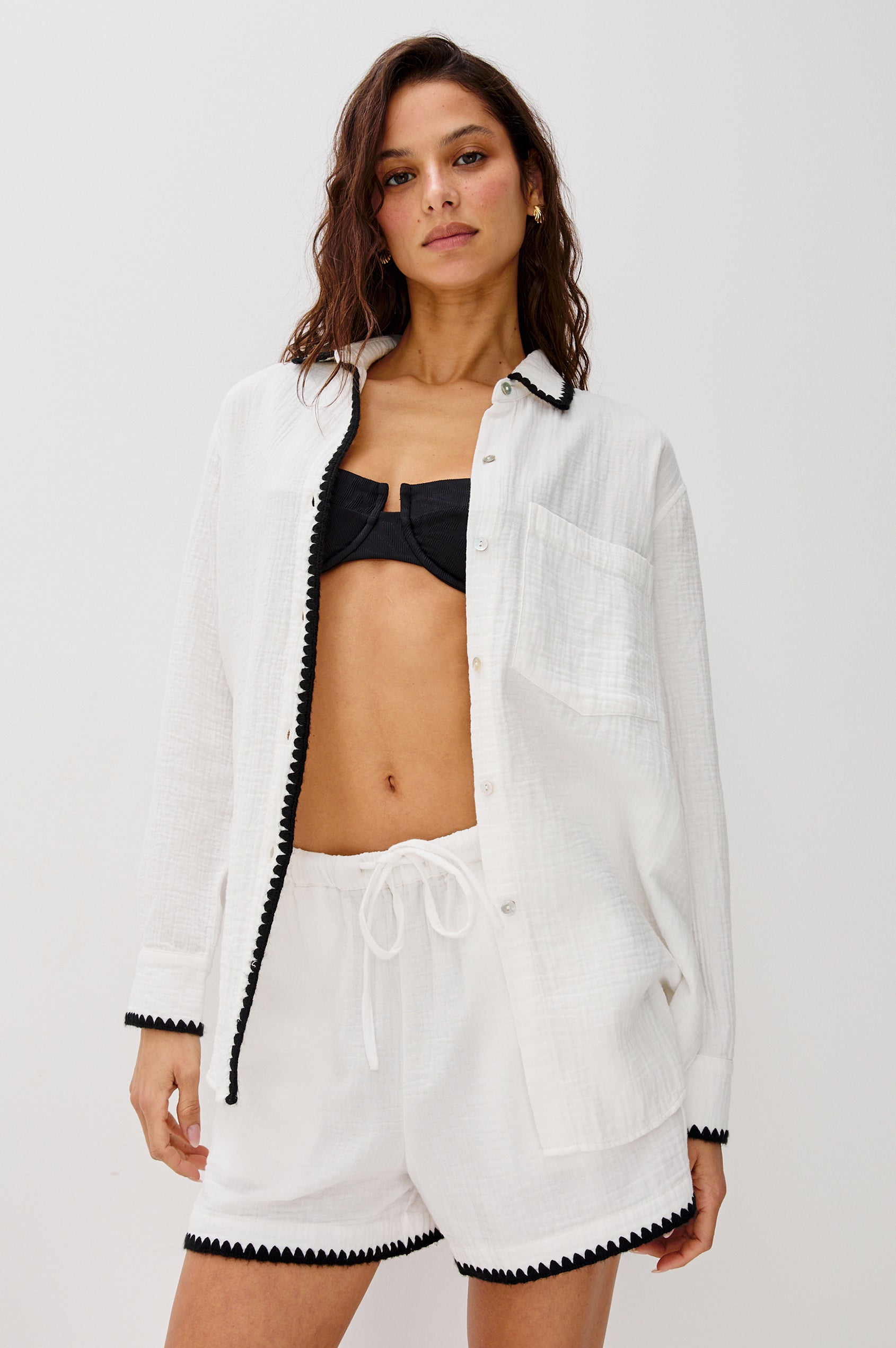 Idania Button Front Collared Shirt with Long Sleeves, Relaxed Fir and a Front Chest Pocket with a White Body in Black Blanket Stich Colorway. Front View Shown on Model.