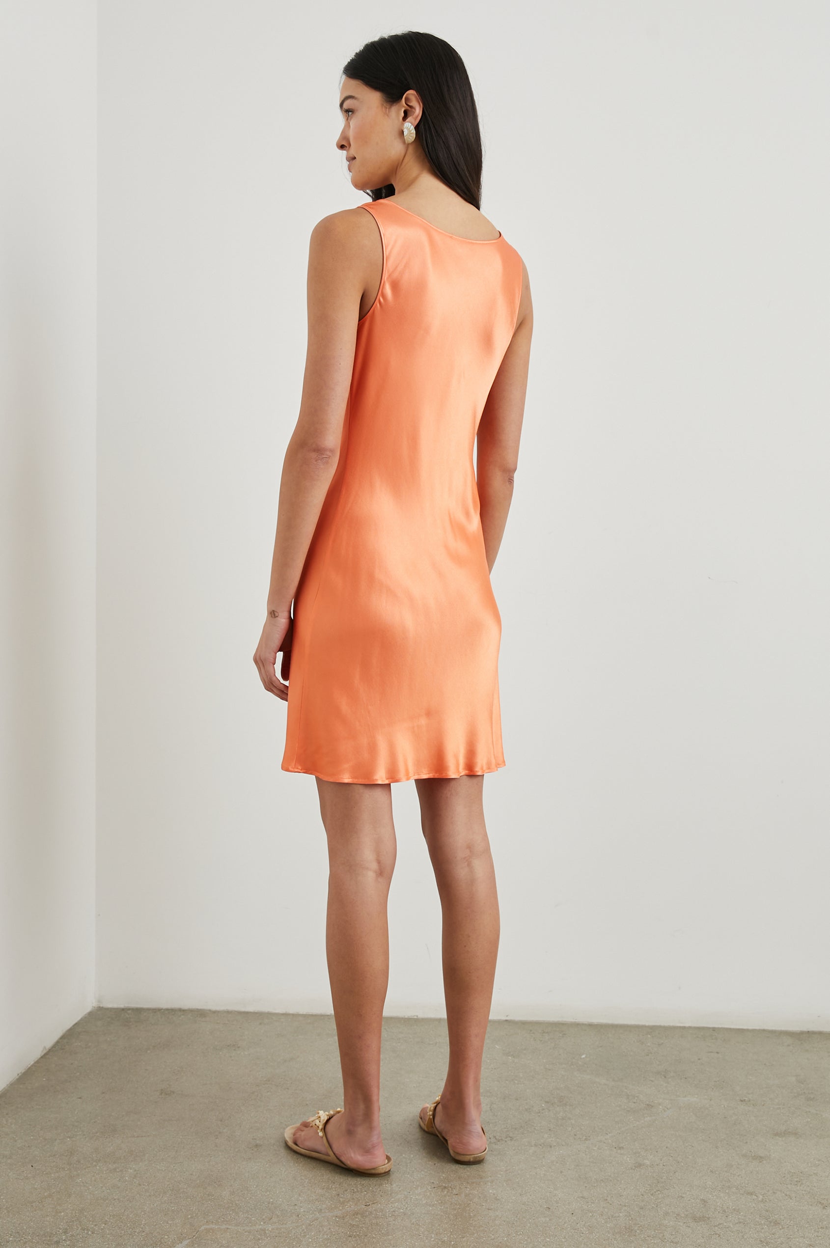 Indra Sleeveless Mini Dress with Wide Straps and a Cowl Neck in Papaya Colorway - Back Full Body View Featured on Model