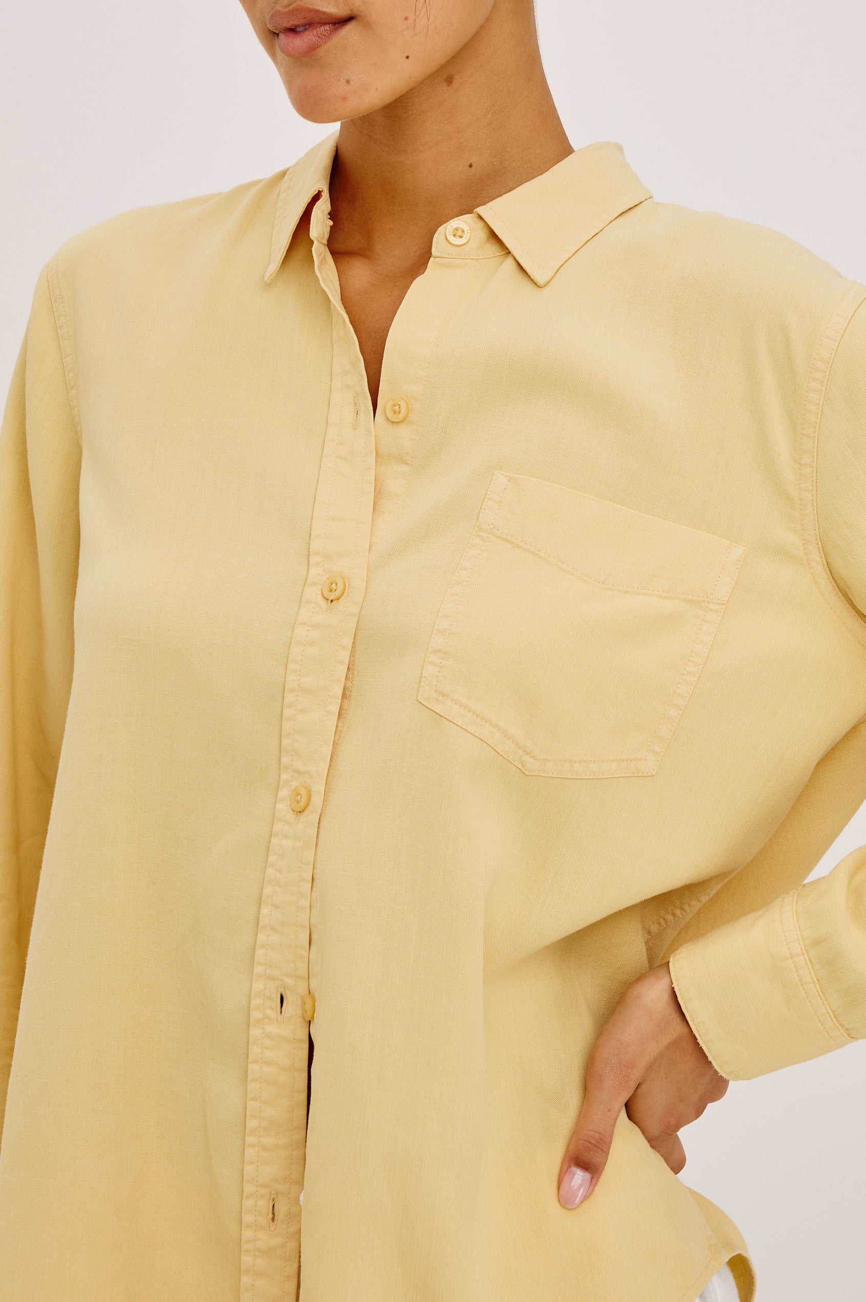 Ingrid Button-Up Shirt in TENCEL™Denim With Collar, Chest Patch Pocket, and Long Sleeves in Italian Straw Colorway - Upper Body Front View Featured on Model