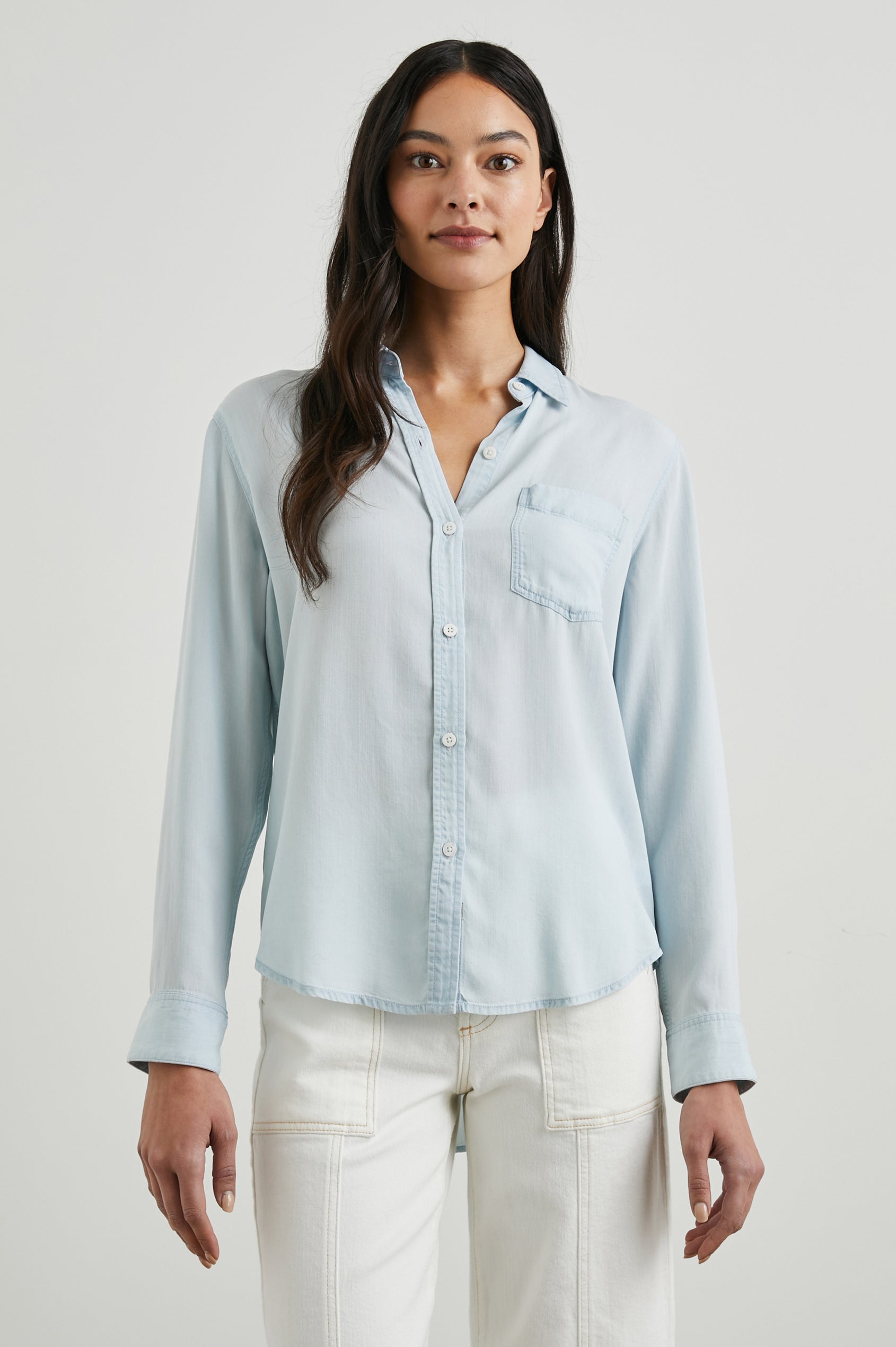 Ingrid Long Sleeve Denim Button Up with a Chest Patch Pocket in Light Vintage Colorway - Front View Featured on Model