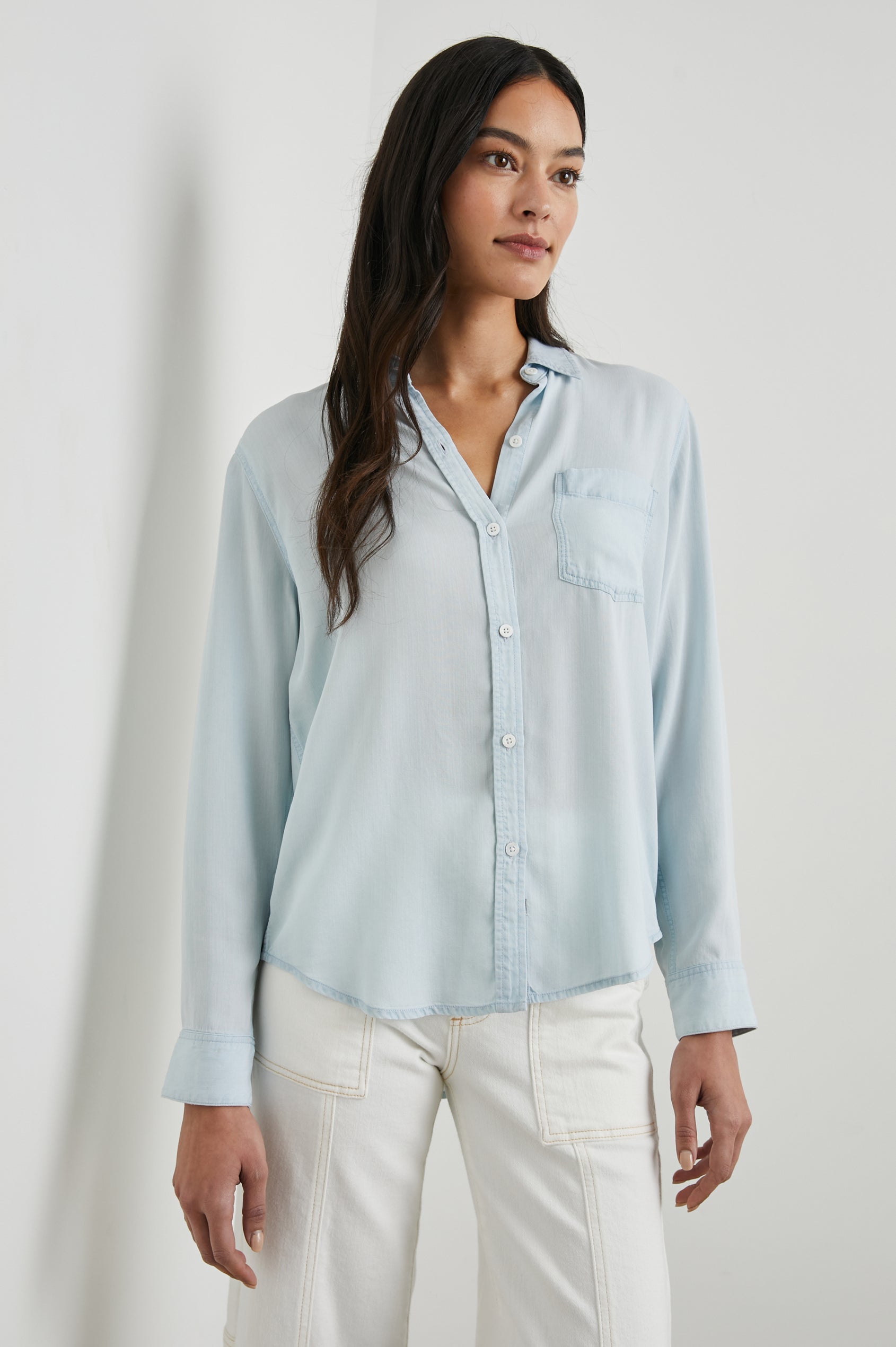 Ingrid Long Sleeve Denim Button Up with a Chest Patch Pocket in Light Vintage Colorway - Front View Featured on Model