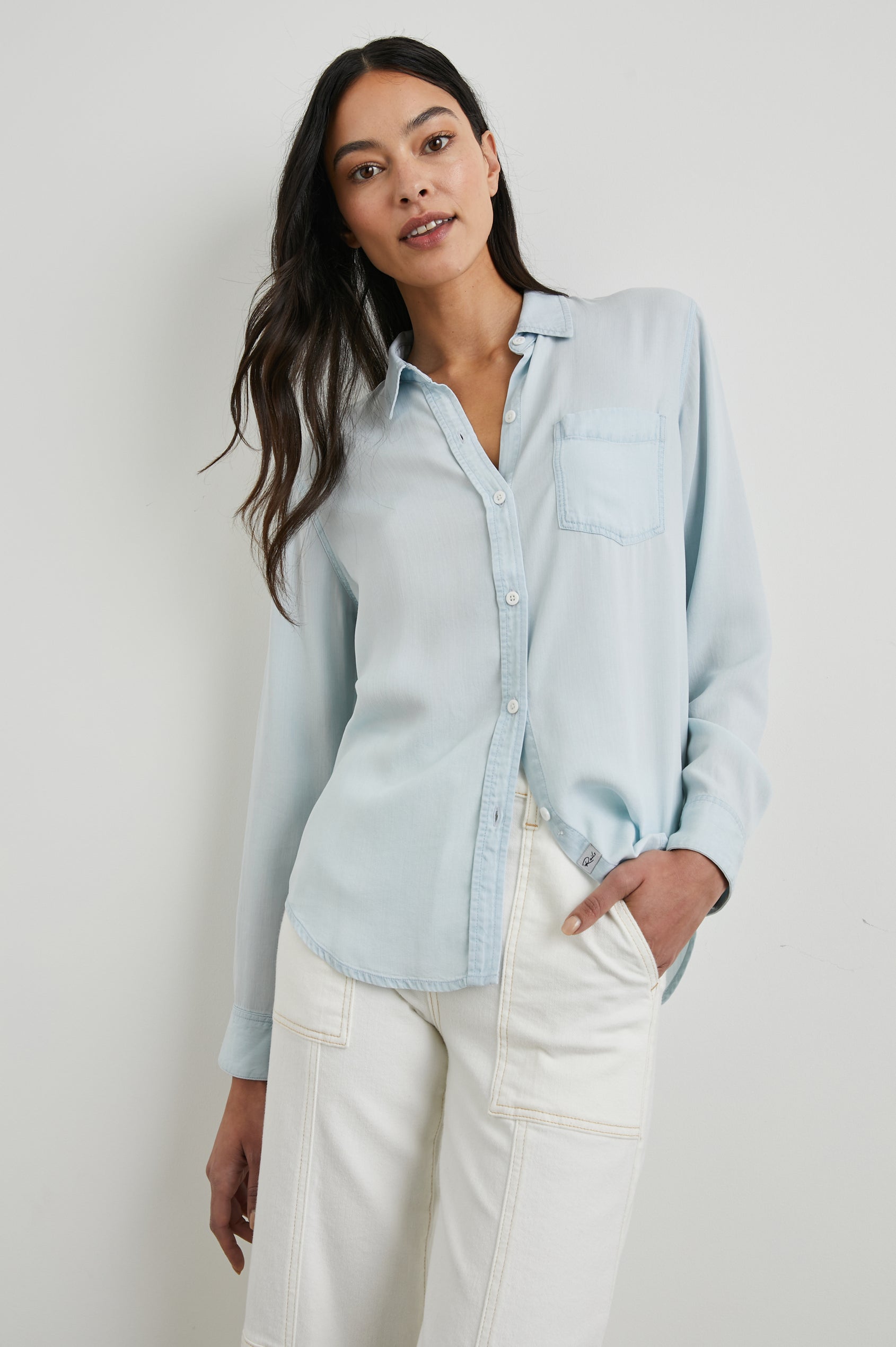Ingrid Long Sleeve Denim Button Up with a Chest Patch Pocket in Light Vintage Colorway - Front View Featured on Model