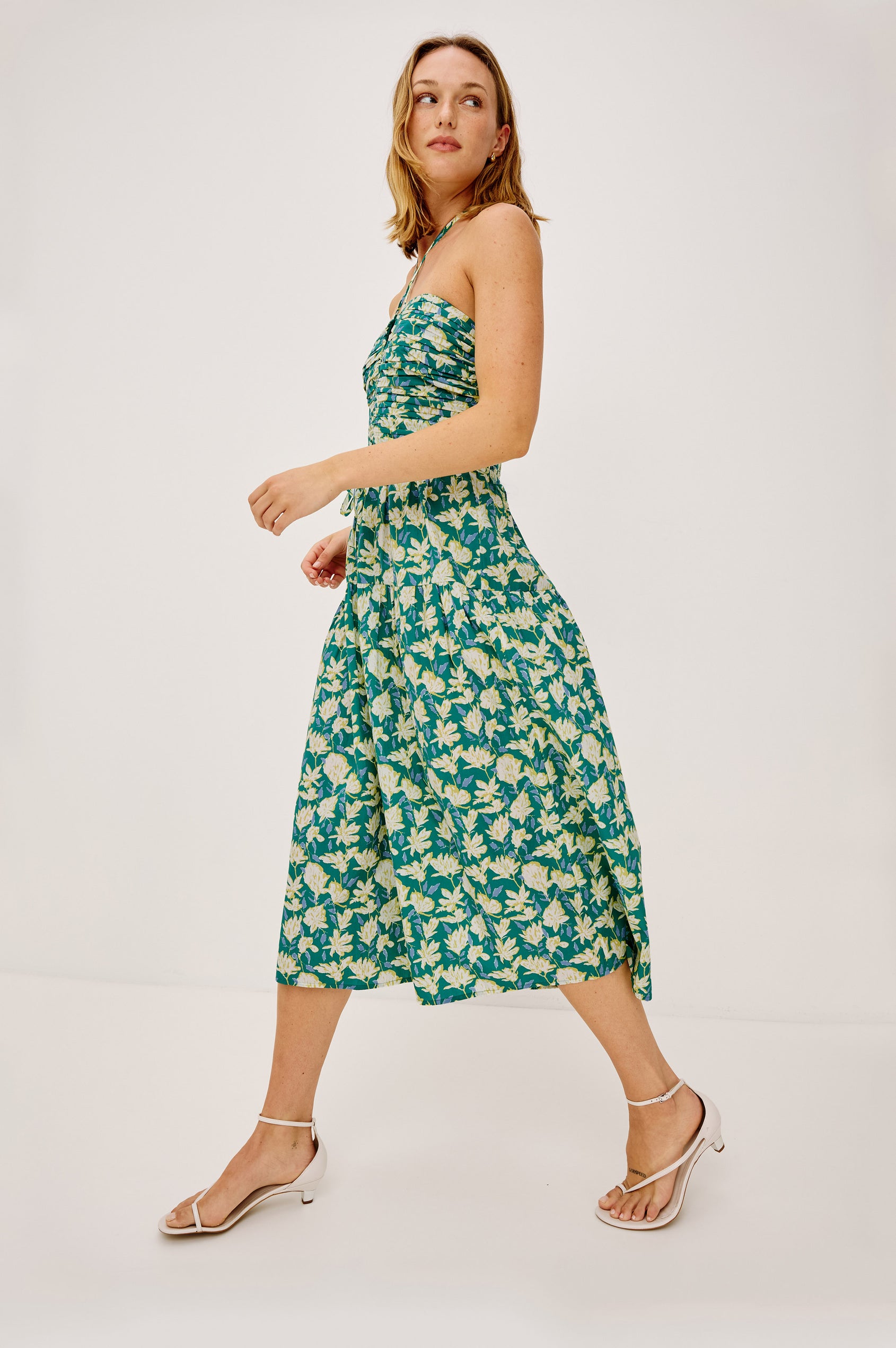 Irene Midi Dress in Cotton Poplin With Ruched Semi-Sheer Keyhole Bodice, Adjustable Halter Ties, Back Smocking, Side Zip, and Fully Lined in Green Mayflower - Full Body Side View Featured on Model