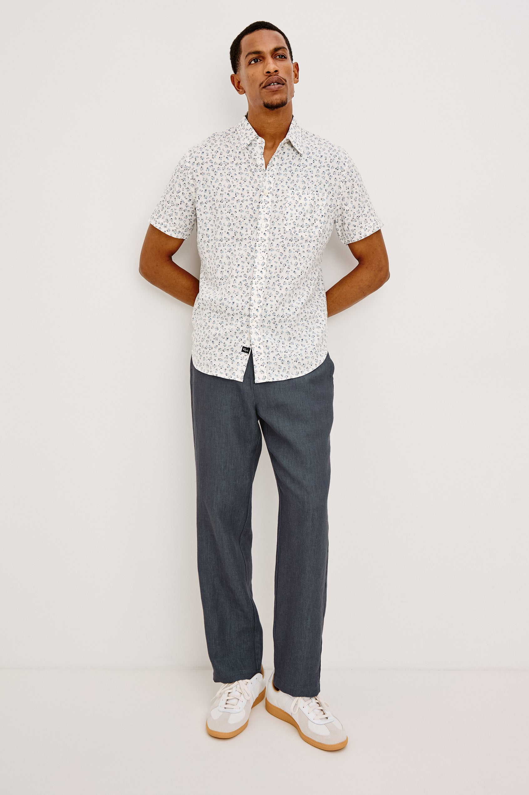 Irving Slim Straight Pant With Side Slant Pockets, and Back Welt Pockets in Meridian, a blue Colorway - Full body Front View Featured on Model