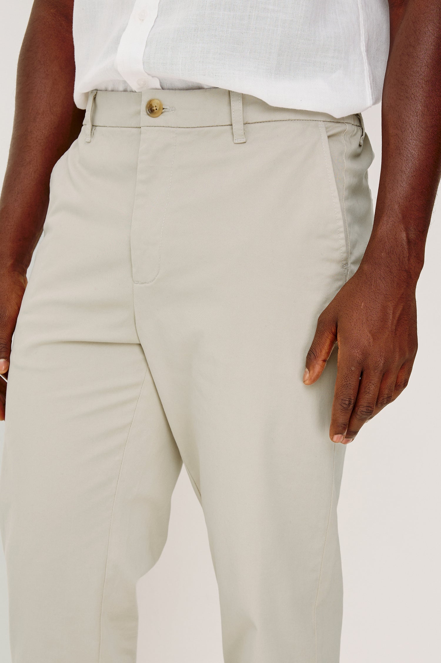 Irving Slim Straight Pant With Side Slant Pockets, and Back Welt Pockets in Stone Colorway - Lower Body Front Detail View Featured on Model