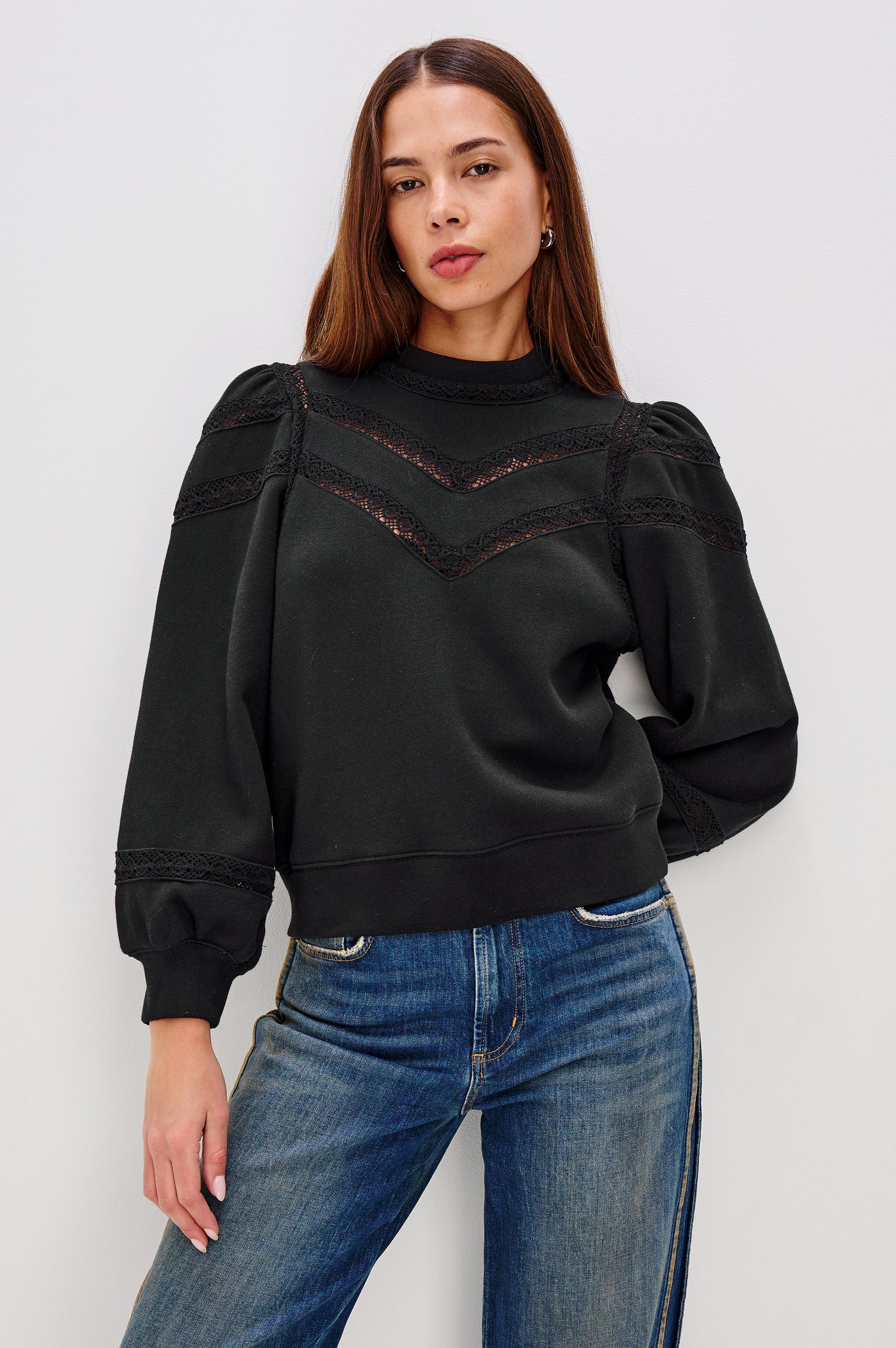 Isles Sweatshirt in French Terry With Sheer Embroidered Trim, a Mockneck, Long Puff Sleeves, and Ribbed Trim in Black Colorway - Upper Body Front View Featured on Model