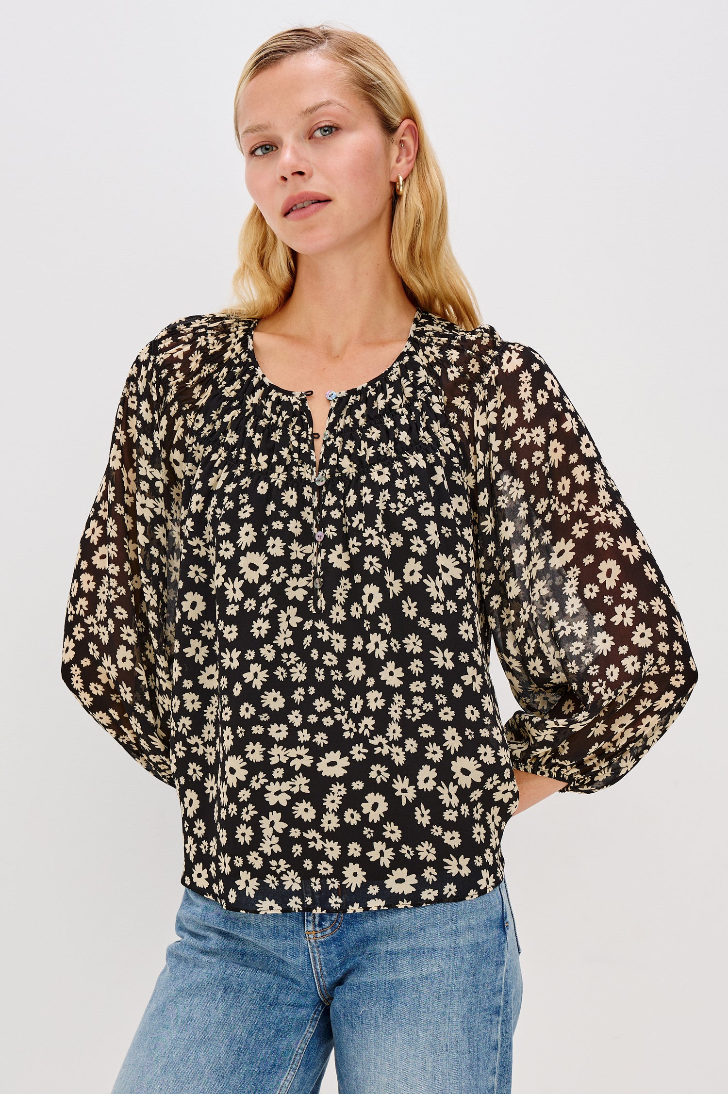 Isolde long sleeve top in Sun Daisies floral print with a feminine button-front detail - front view featured on model.