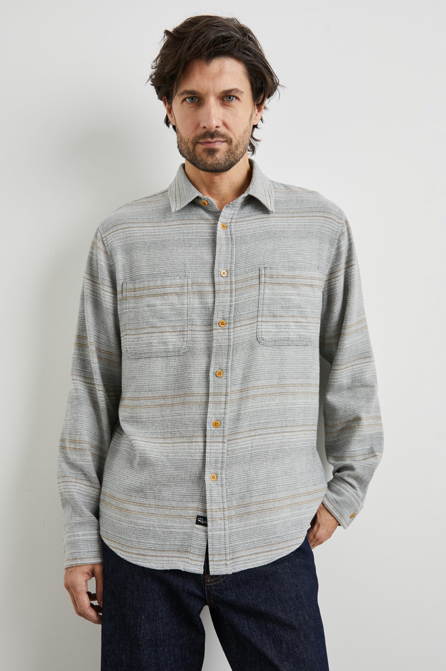 Ivan Long-Sleeve Button Up with Two Chest Patch Pockets in Grey Serape Colorway, with horizontal stripes in browns and greys on Grey - Front View Featured on Model