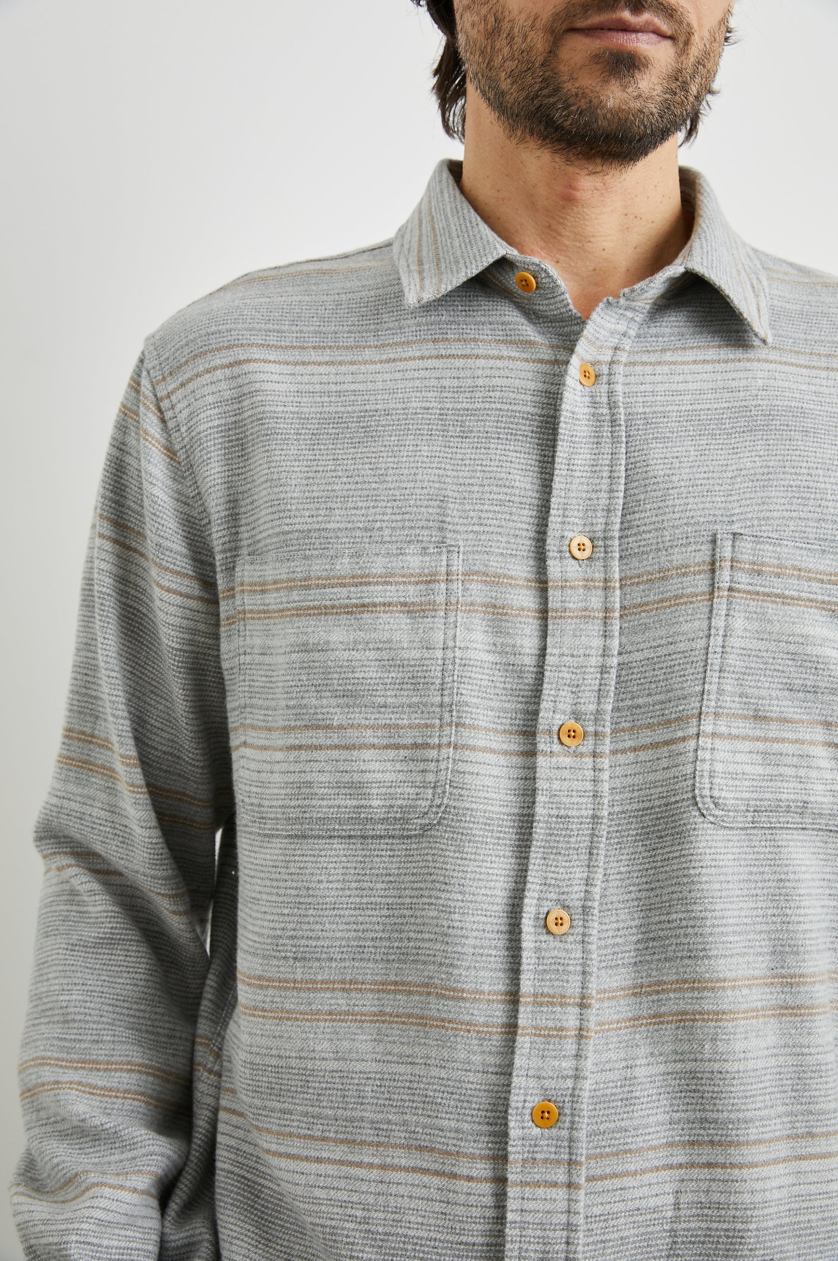 Ivan Long-Sleeve Button Up with Two Chest Patch Pockets in Grey Serape Colorway, with horizontal stripes in browns and greys on Grey - Front View Featured on Model