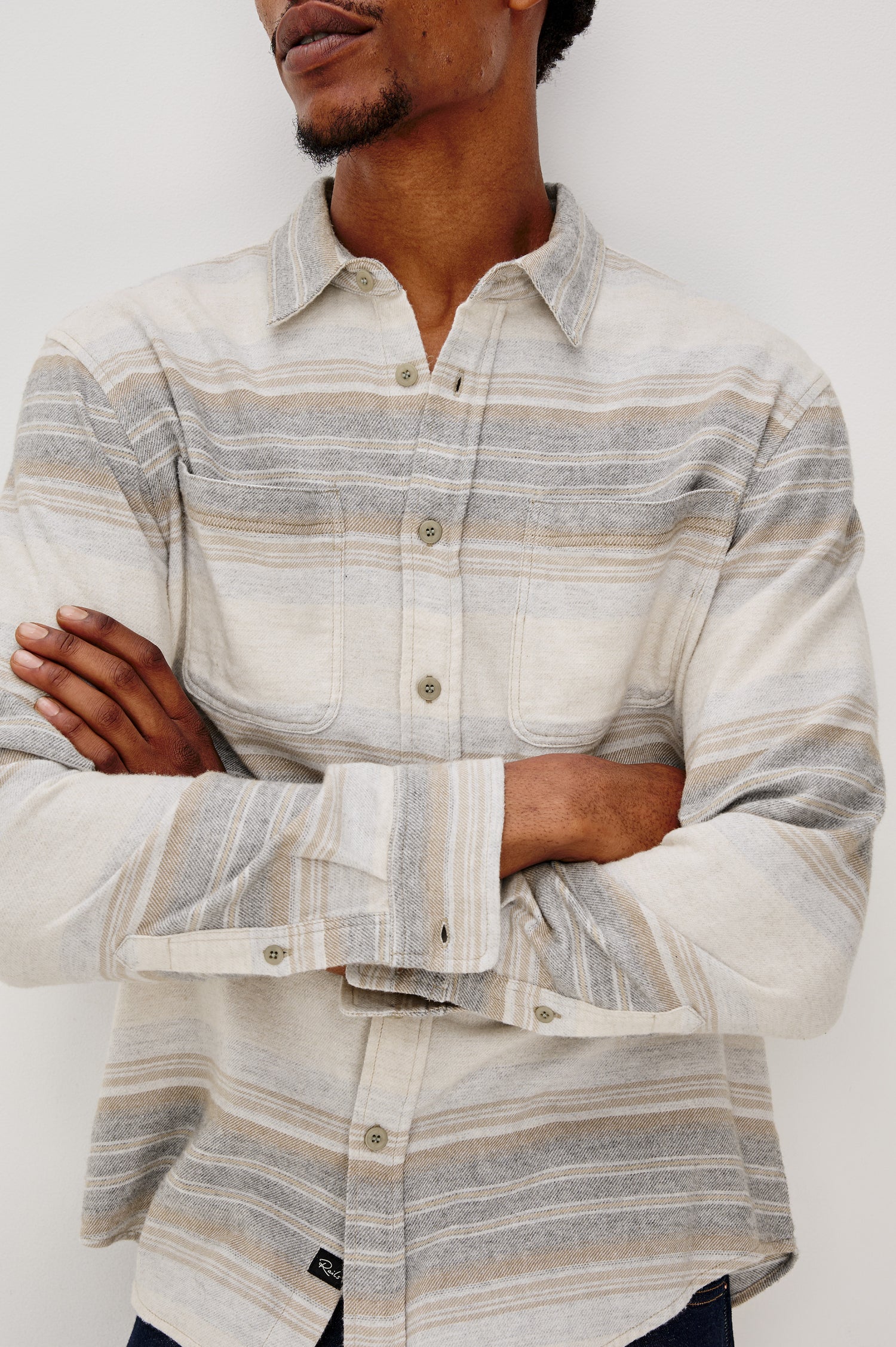 Ivan button front collared shirt with long sleeves and two chest pockets in horizontal stripe - lunar rock stripe colorway. Front Detail View on Model Shown.