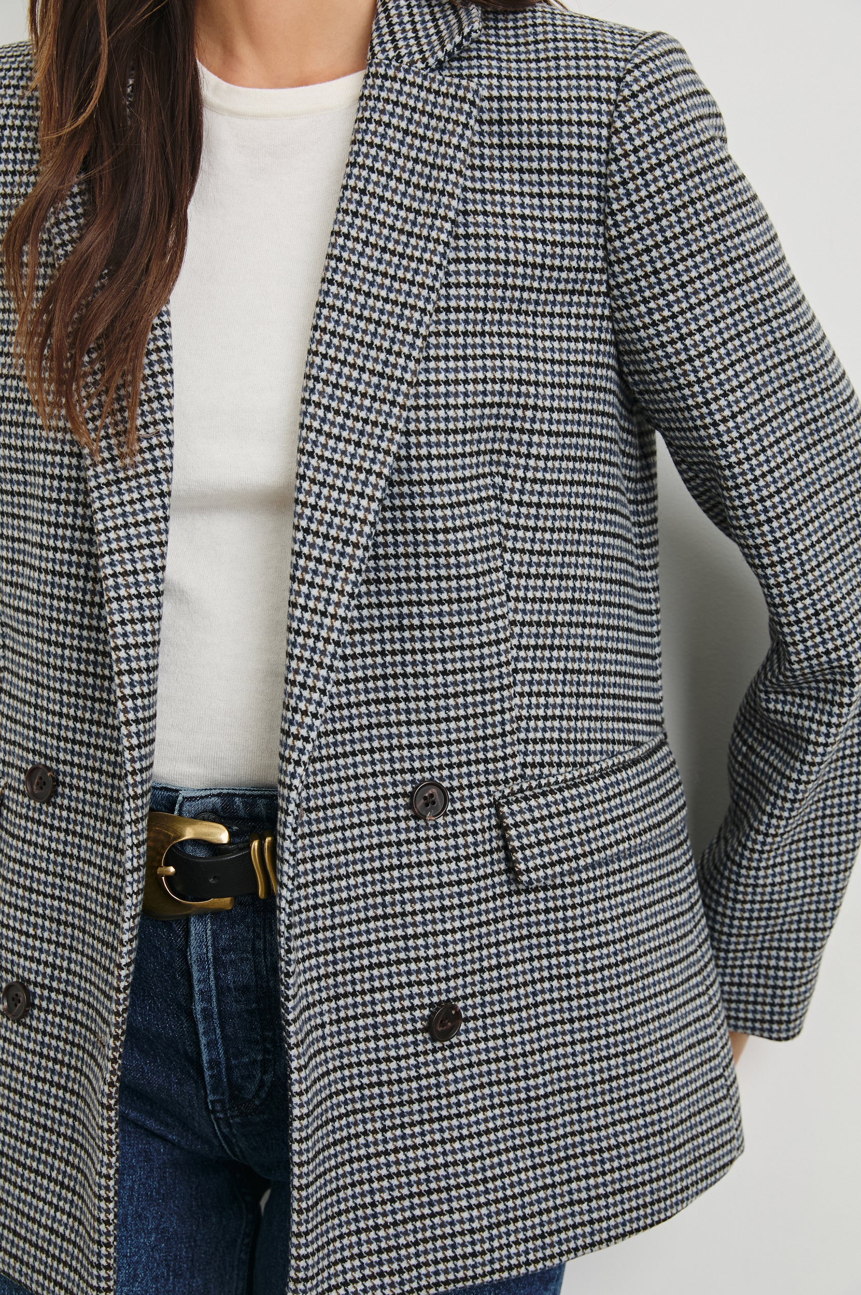 Jac Double-Breasted Blazer with Two Front Flap Pockets and a Notched Label in Black Lapiz Colorway, Houndstooth with black, blue, brown and cream - Front View Featured on Model