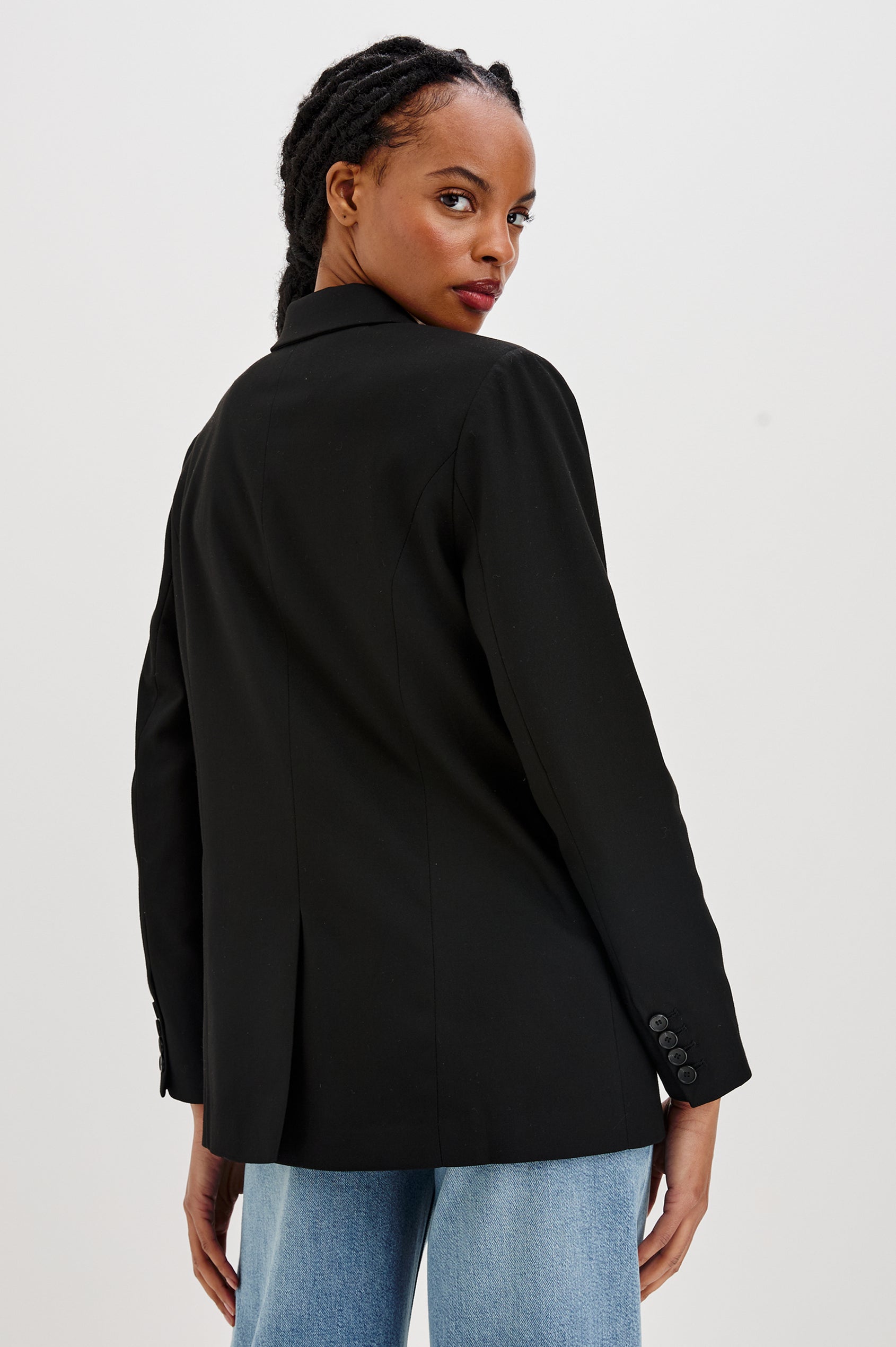 Jac Double-Breasted Blazer with Two Front Flap Pockets and a Notched Label in Black Twill Colorway - Back View Featured on Model