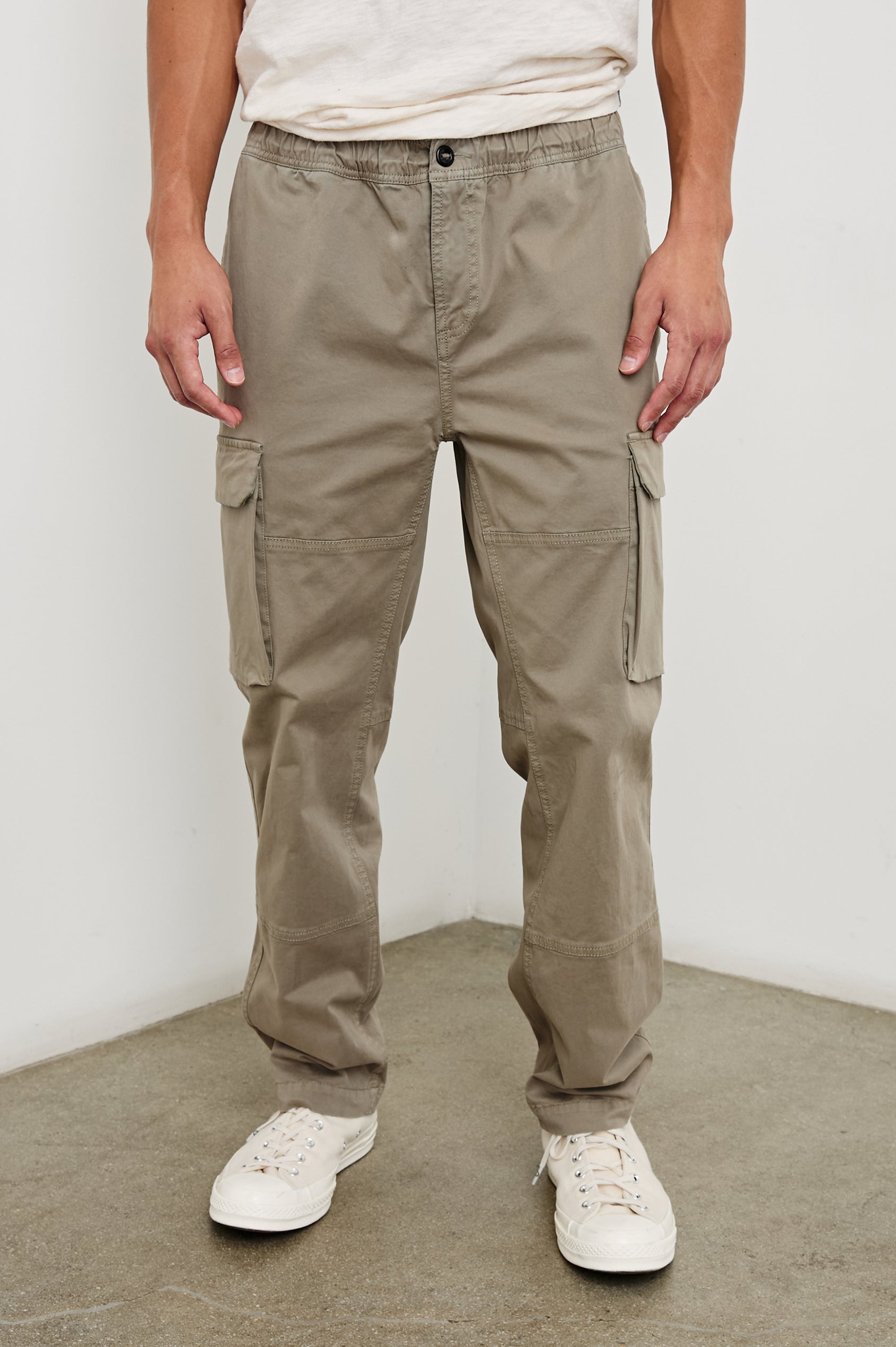 Jaiden Pants with an Elastic, Button Waist with Zip Fly, Two Front Pockets, Two Side Flap Pockets, and Two Back Flap Pockets in Barley Colorway - Front View Featured on Model